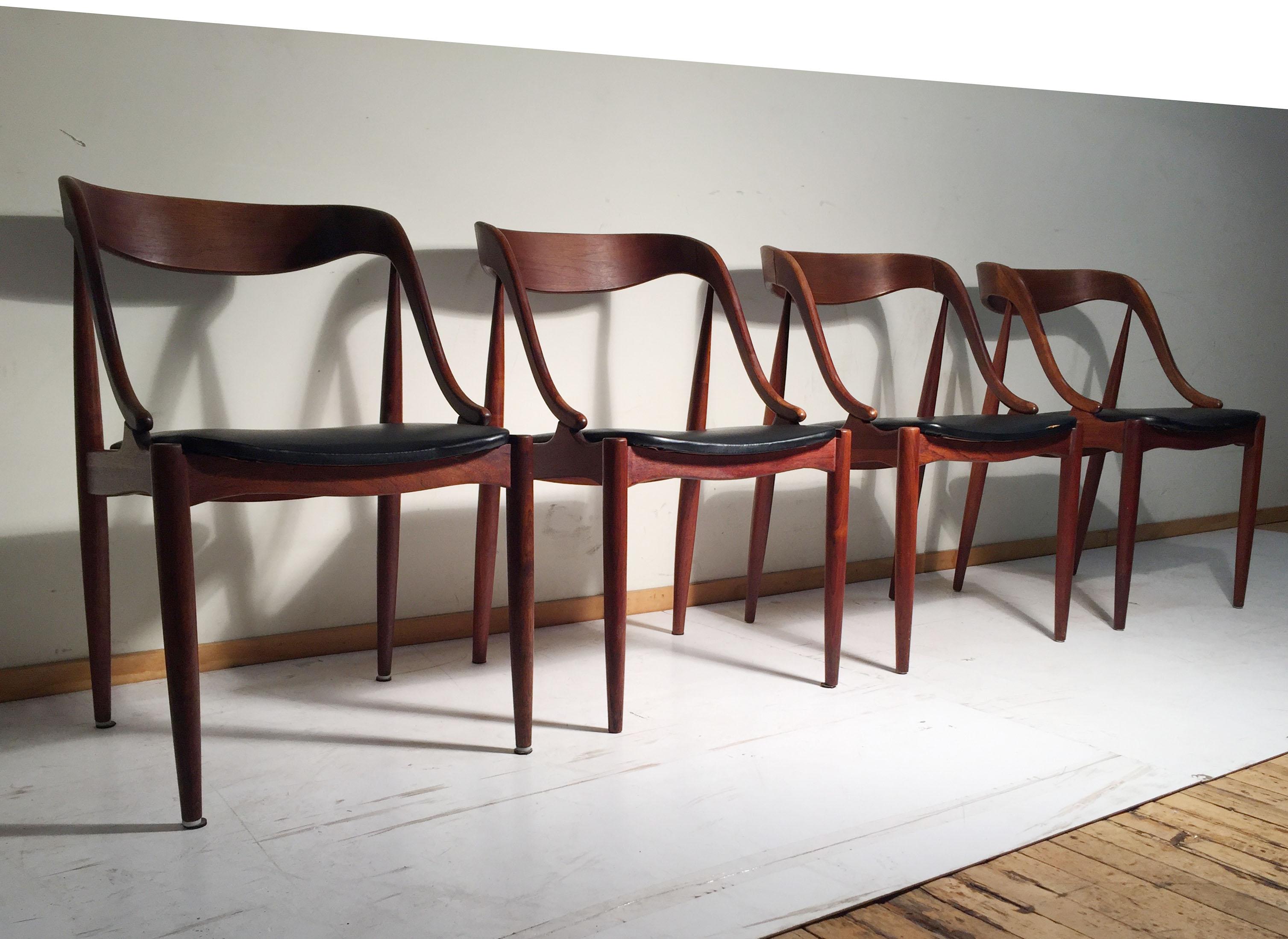 A vintage set of 4 Johannes Andersen teak dining chairs for Moreddi.