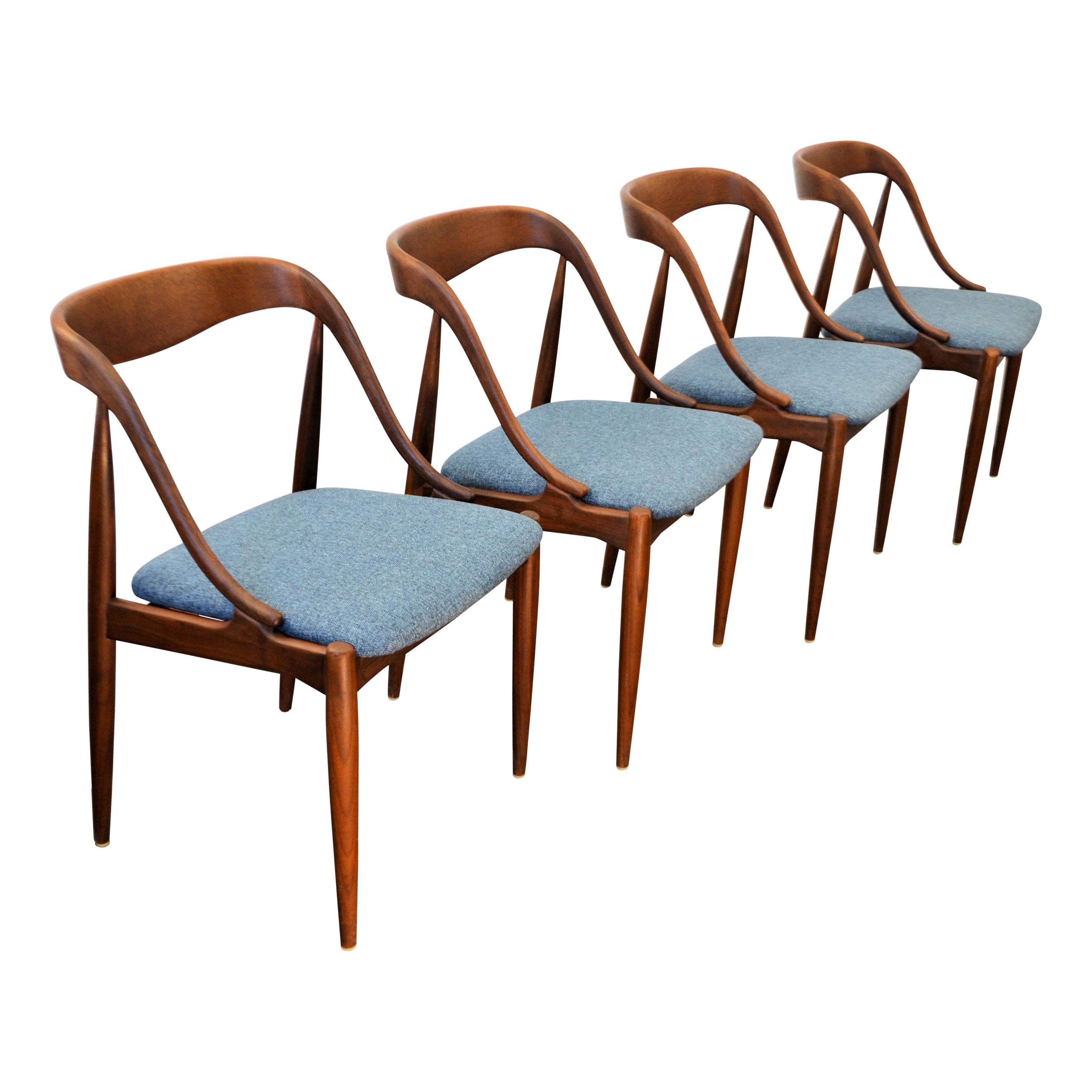 Set of four Mid-Century Modern Danish dining chairs designed in the 1960s by worldwide known and appreciated furniture designer Johannes Andersen. His designs are considered high end Danish modern design. The chairs feature Andersen’s characteristic