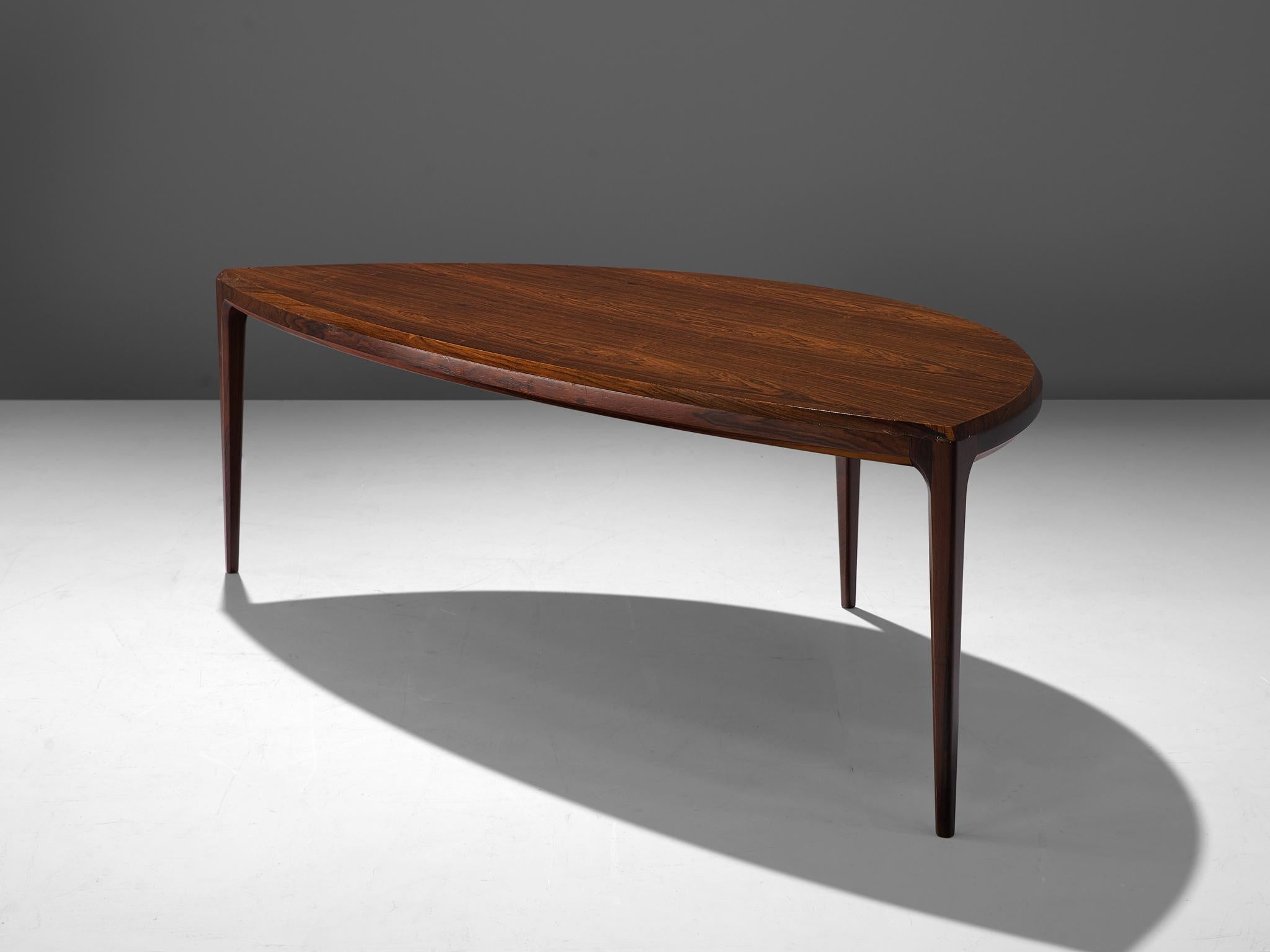 Johannes Andersen for Silkeborg, coffee table, rosewood, Denmark, 1950s.

Organic shaped coffee table in rosewood. This three legged coffee table shows the great craftsmanship of Johannes Andersen as furniture designer. The design is simplified, yet