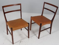 Johannes Andersen dos sillas de comedor, palisandro y tapicería de cuero