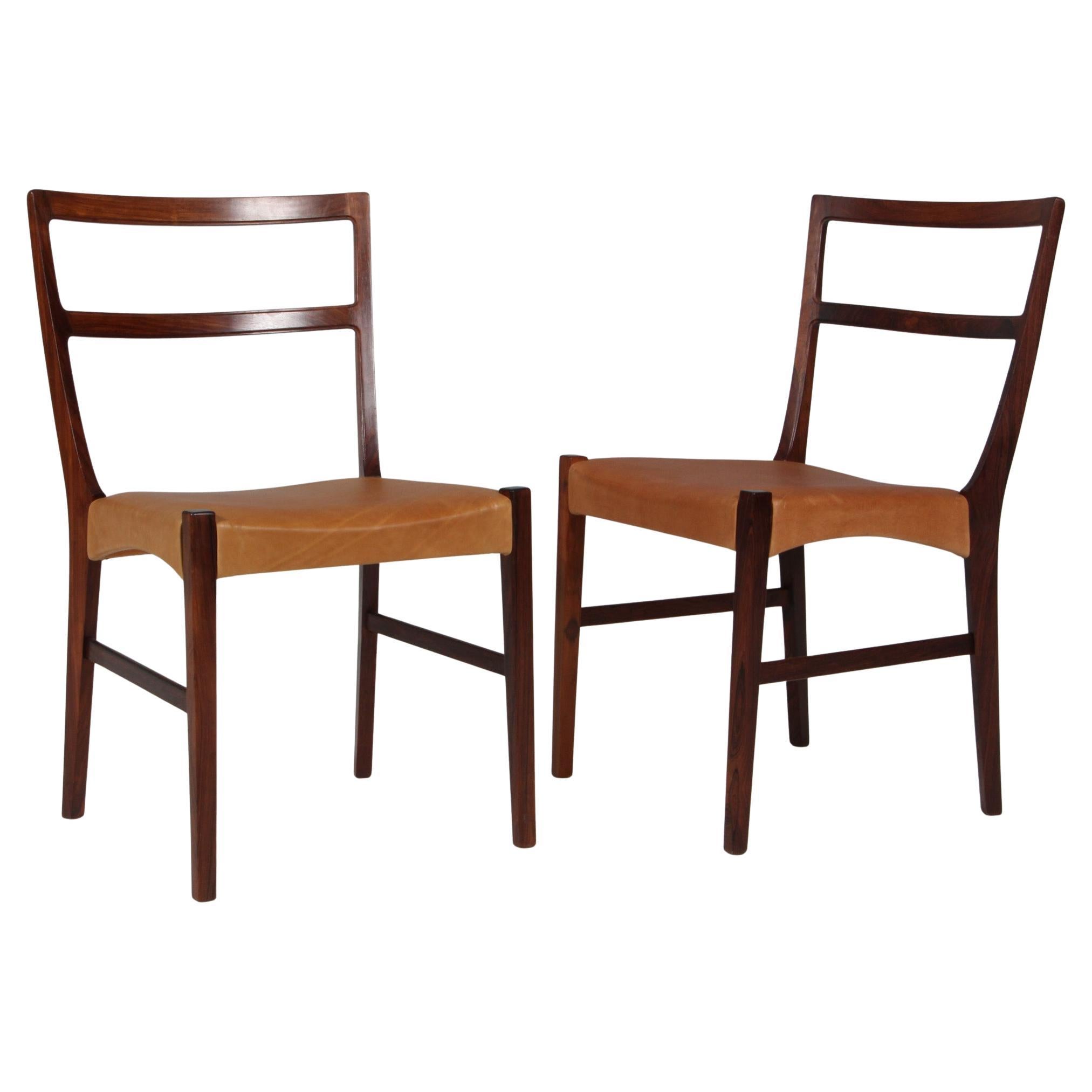 Johannes Andersen two Dining Chairs, Rosewood and Leather Upholstery