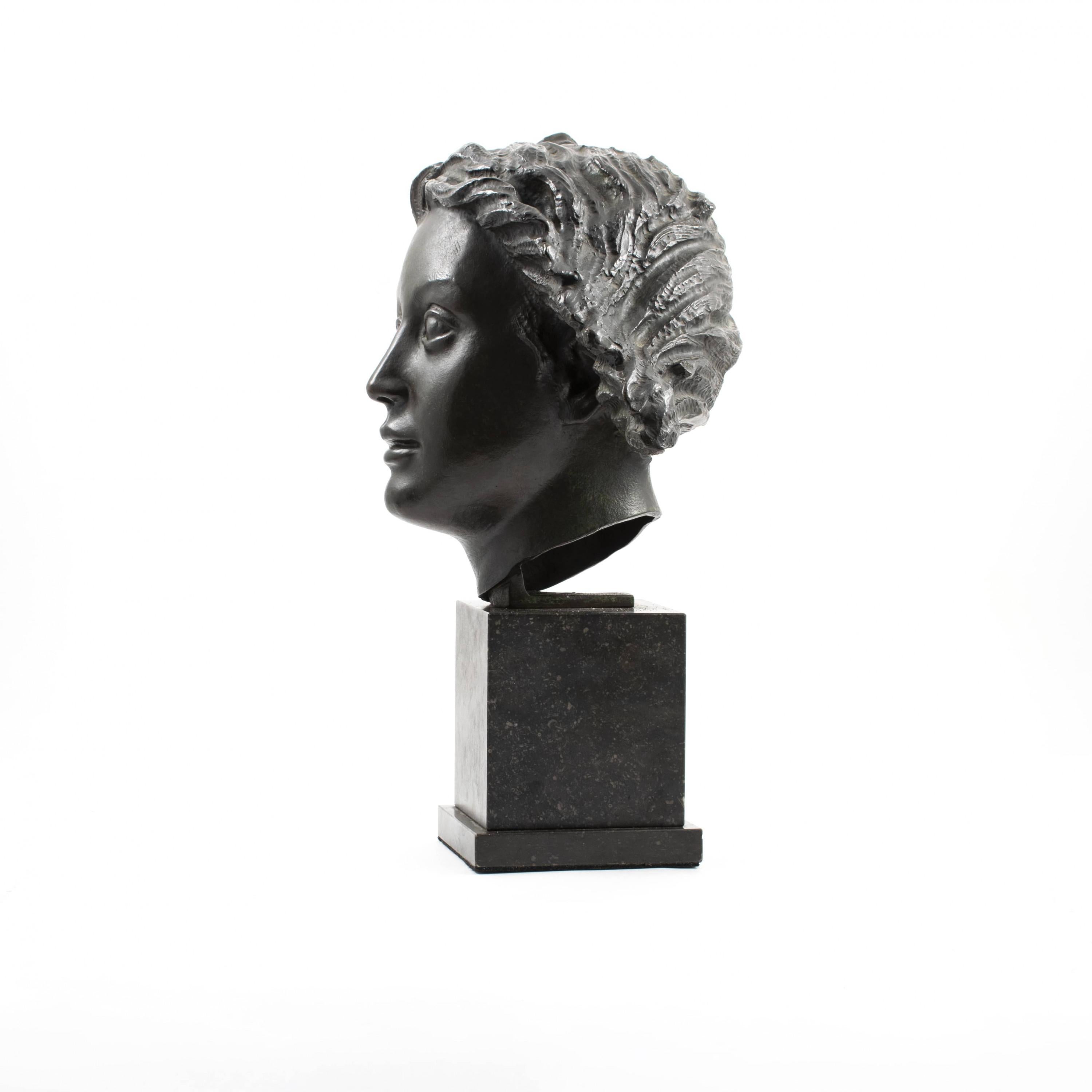 Johannes C. Bjerg 1886-1955.
Dark patinated bronze head of the Greek Goddess Artemis mounted on a black marble base.
Stamp from bronze caster L. Rasmussen. Unsigned

1934. Casting of the head for the Artemis fountain, which stands in the middle