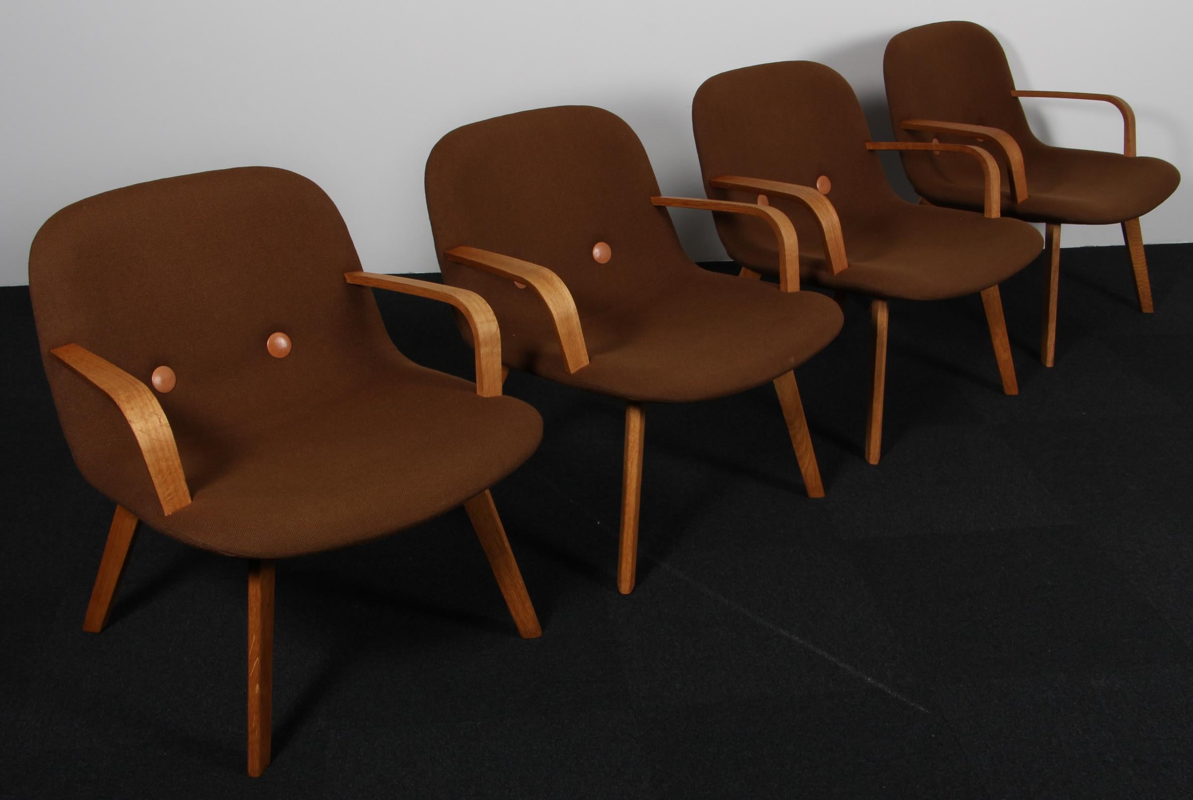 Johannes Foersom & Peter Hjorth-Lorentzen for Erik Jørgensen. Lounge Chair with Hallingdal wool from Kvadrat, buttons of tan full grain aniline leather.

Legs of soap treated oak..

Model EYE. Made by Erik Jørgensen.