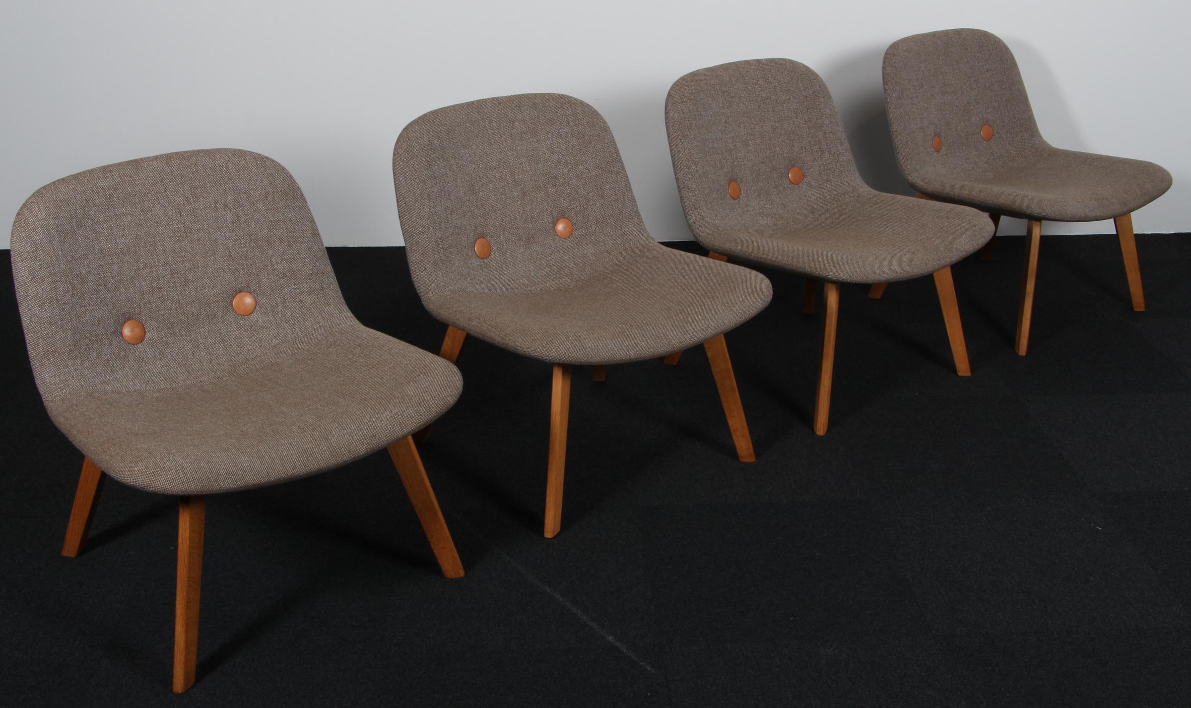 Johannes Foersom & Peter Hjorth-Lorentzen for Erik Jørgensen. Lounge Chair with Hallingdal wool from Kvadrat, buttons of tan full grain aniline leather.

Legs of soap treated oak..

Model EYE. Made by Erik Jørgensen.