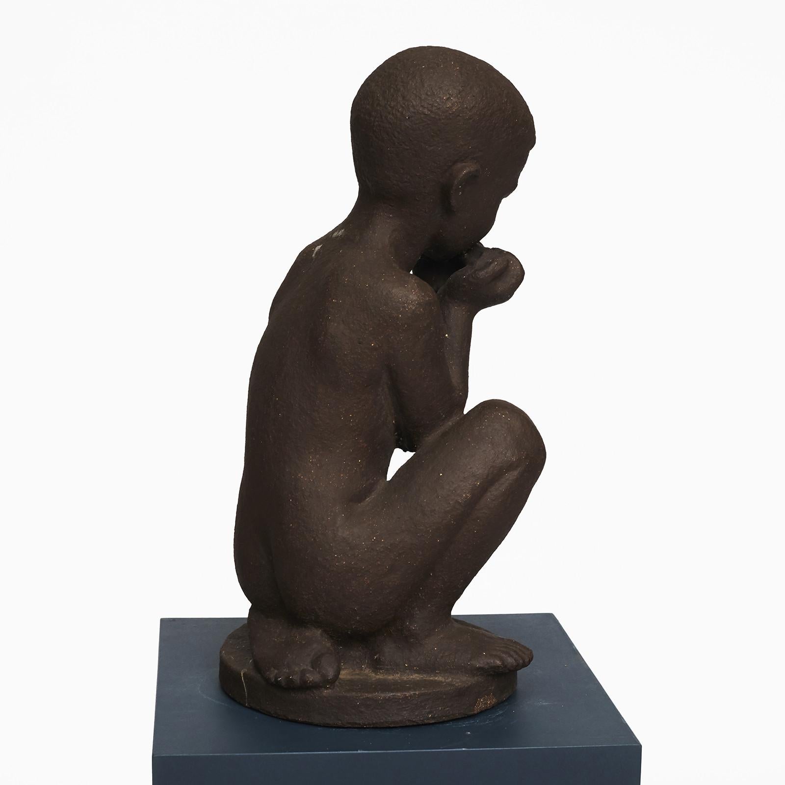Large ceramic figurine.
Designed by Johannes Hansen (1903-1995) and manufactured by Knabstrup ceramic factory in Denmark.
Boy playing harmonica.
The figurine are made of dark chamotte clay without glaze.
Has a firing crack on the backside of the
