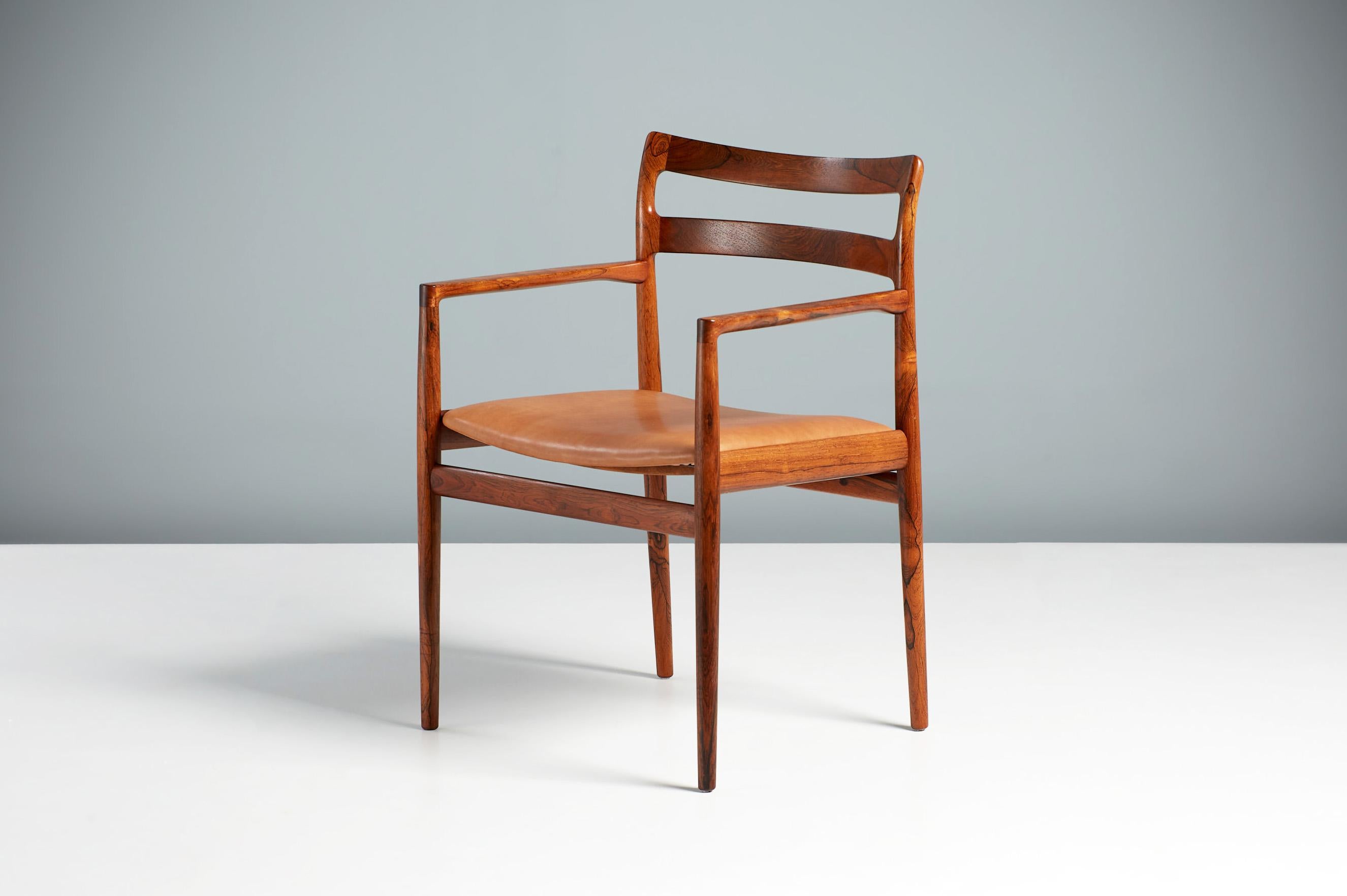 Johannes Norgaard armchair, circa 1960s

Rarely seen armchair from lesser-known Danish designer Johannes Norgaard. This piece is made from exquisite, highly figured rosewood. The seat has been reupholstered in tan brown aniline leather with new