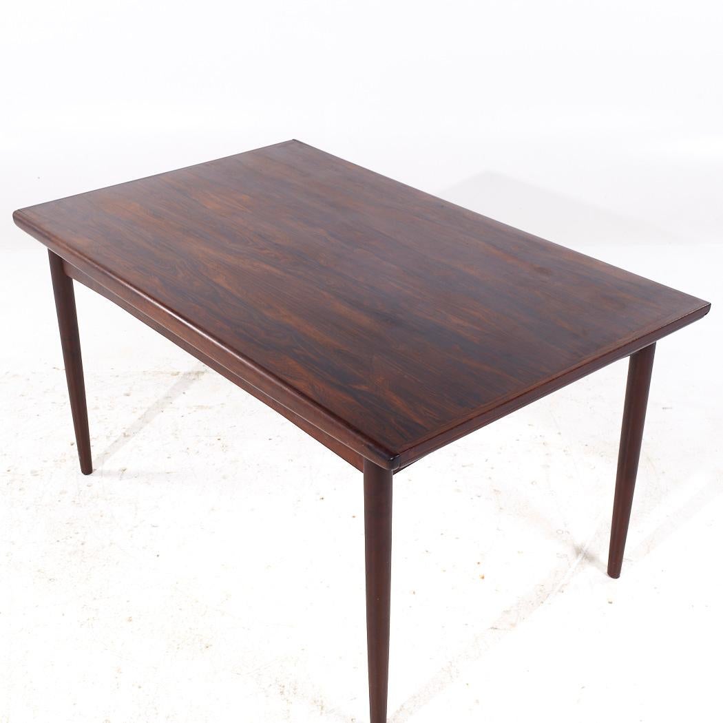 Danois Johannes Nørgaards Møbelfabrik MCM Table à feuilles cachées en bois de rose danois en vente