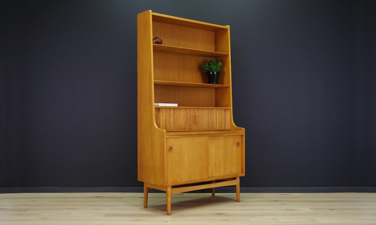 Unique library, bookcase, secretary from the 1960s, a Minimalist form designed by Johannes Sorth. Spacious box with sliding doors, adjustable shelves, extendable top, sliding doors behind which there are numerous compartments and drawers. Furniture