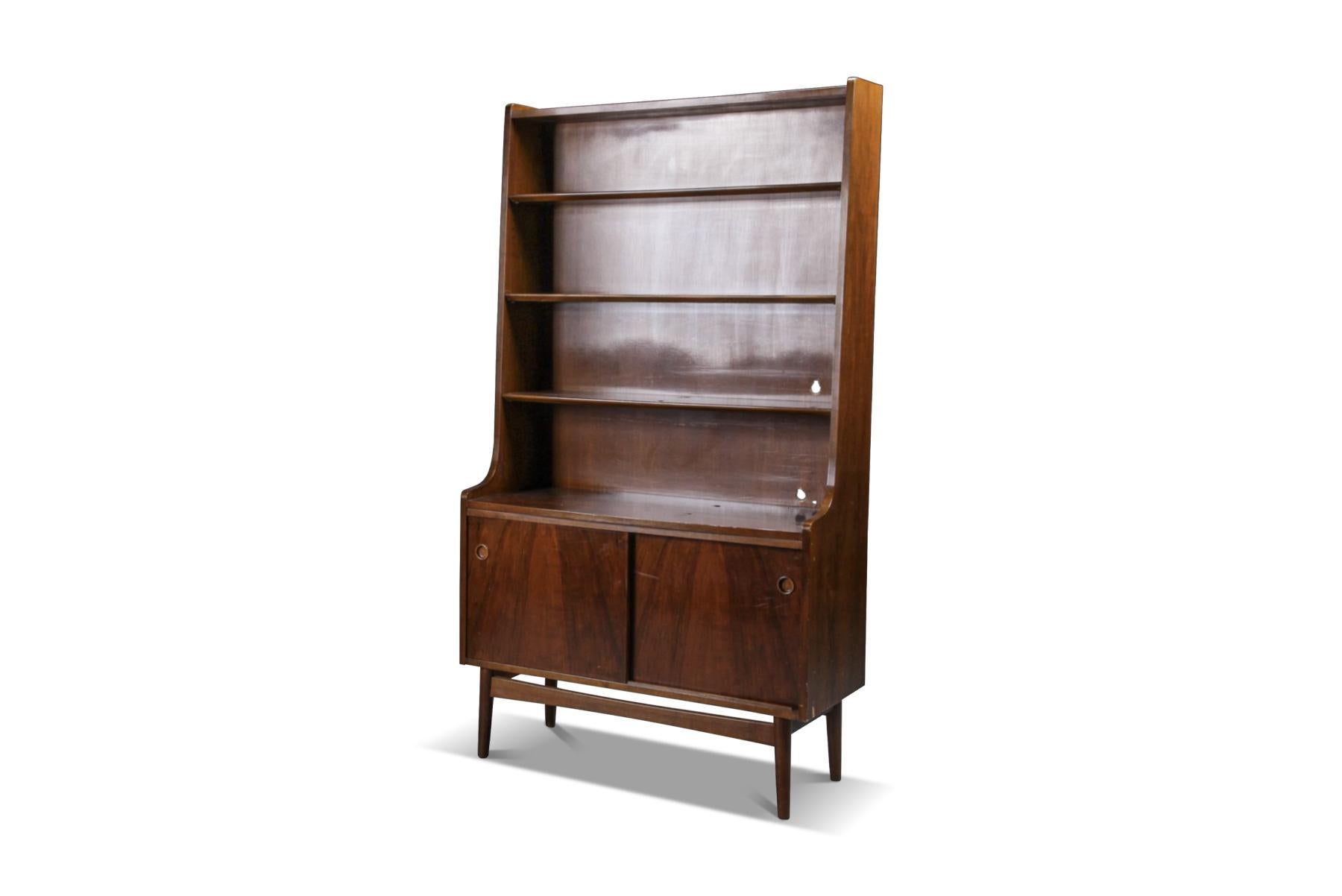 Origin: Denmark
Designer: Johannes Sorth
Manufacturer: Bornholms Møbelfabrik
Era: 1960s
Materials: Nutwood, Beech
Measurements: 39.75? wide x 17