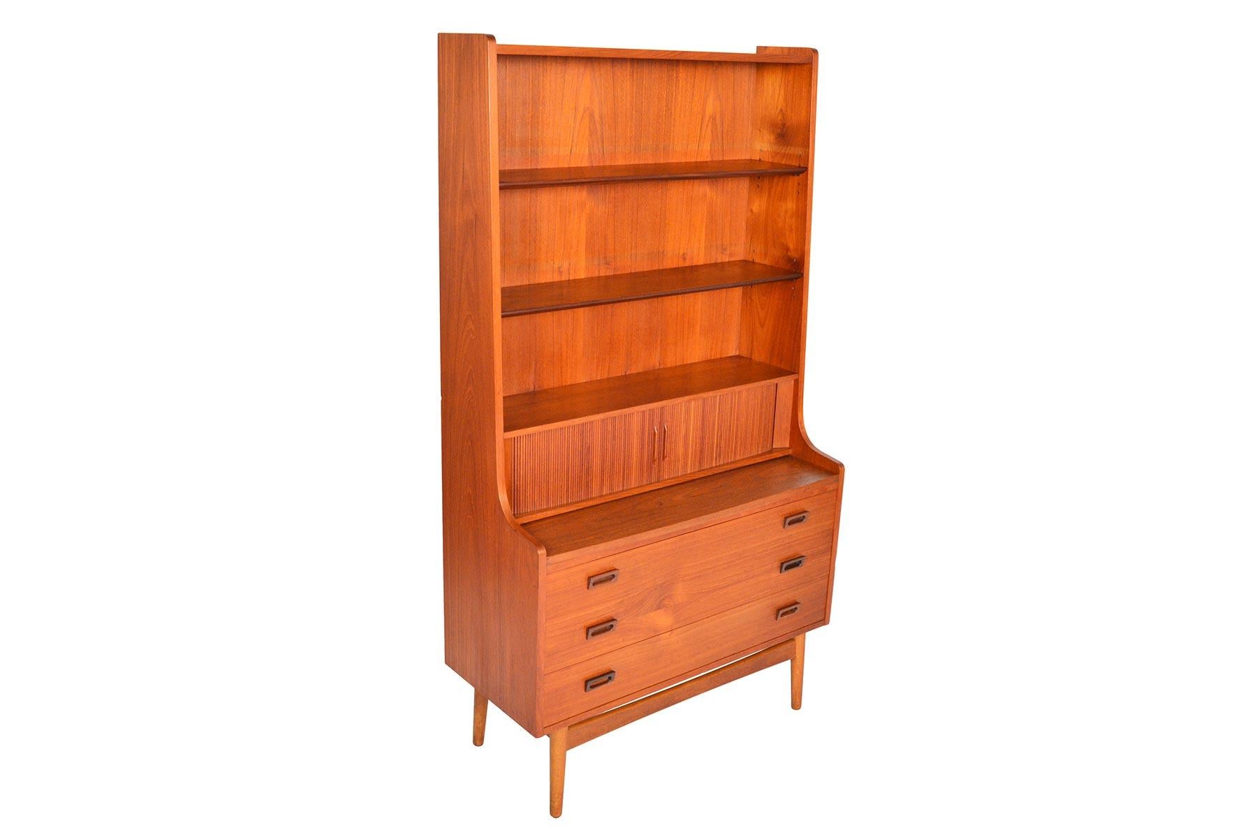 This beautiful Danish modern midcentury bookcase in teak was designed by Johannes Sorth for Bornholm Møbelfabrik, Nexø in the 1960s. The tall, upper hutch features three adjustable shelves. The lower cabinet offers three large drawers for plenty of