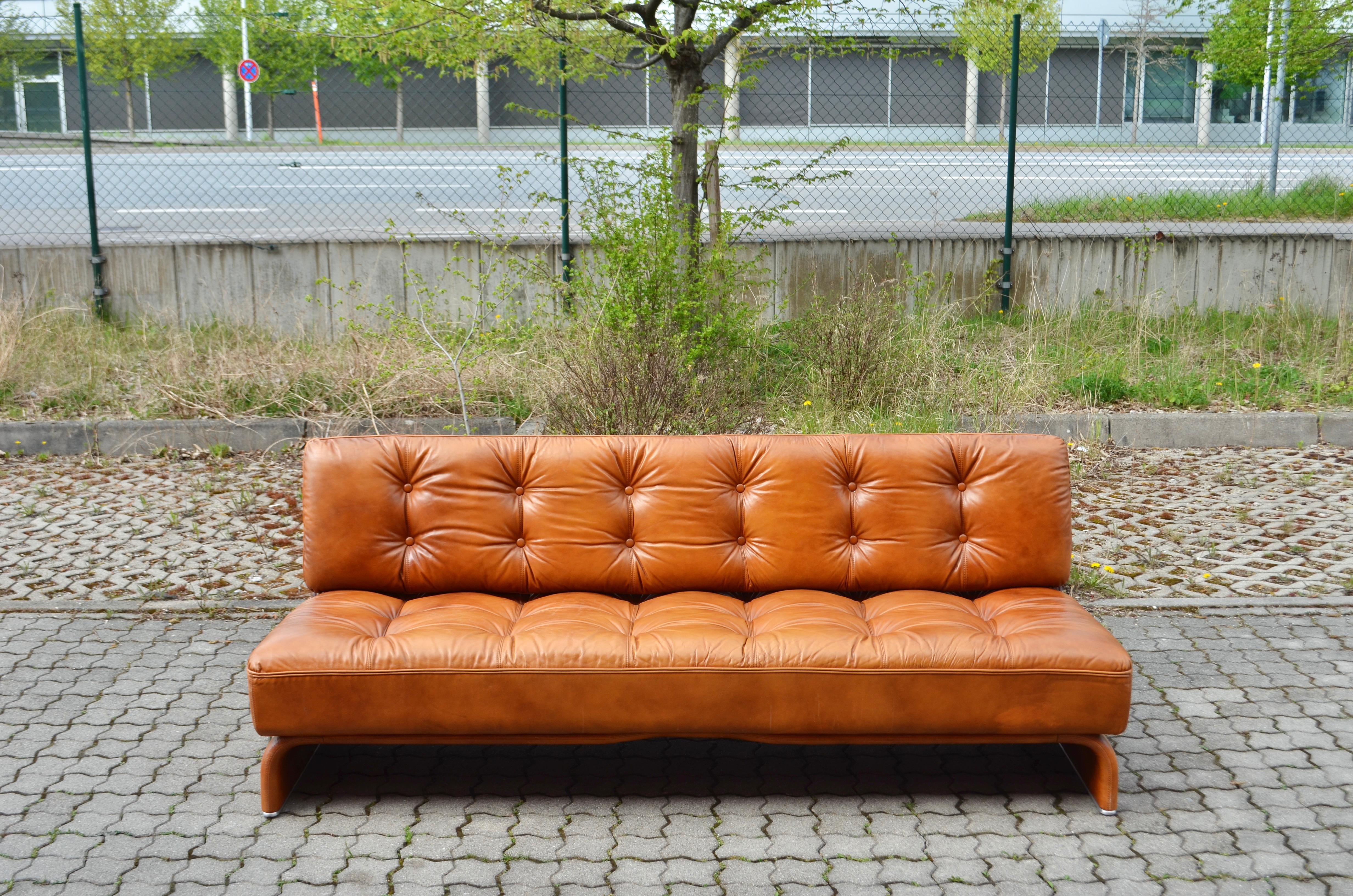 Daybed Modell Constanze by Austrian architect Johannes Spalt for Wittmann. 
A classic Mid Century Daybed in tufted design.
Produced in the 1960s.
Cognac Semianiline leather. The sofa is convertible into a daybed. 
Best condition
Size 198 x 107