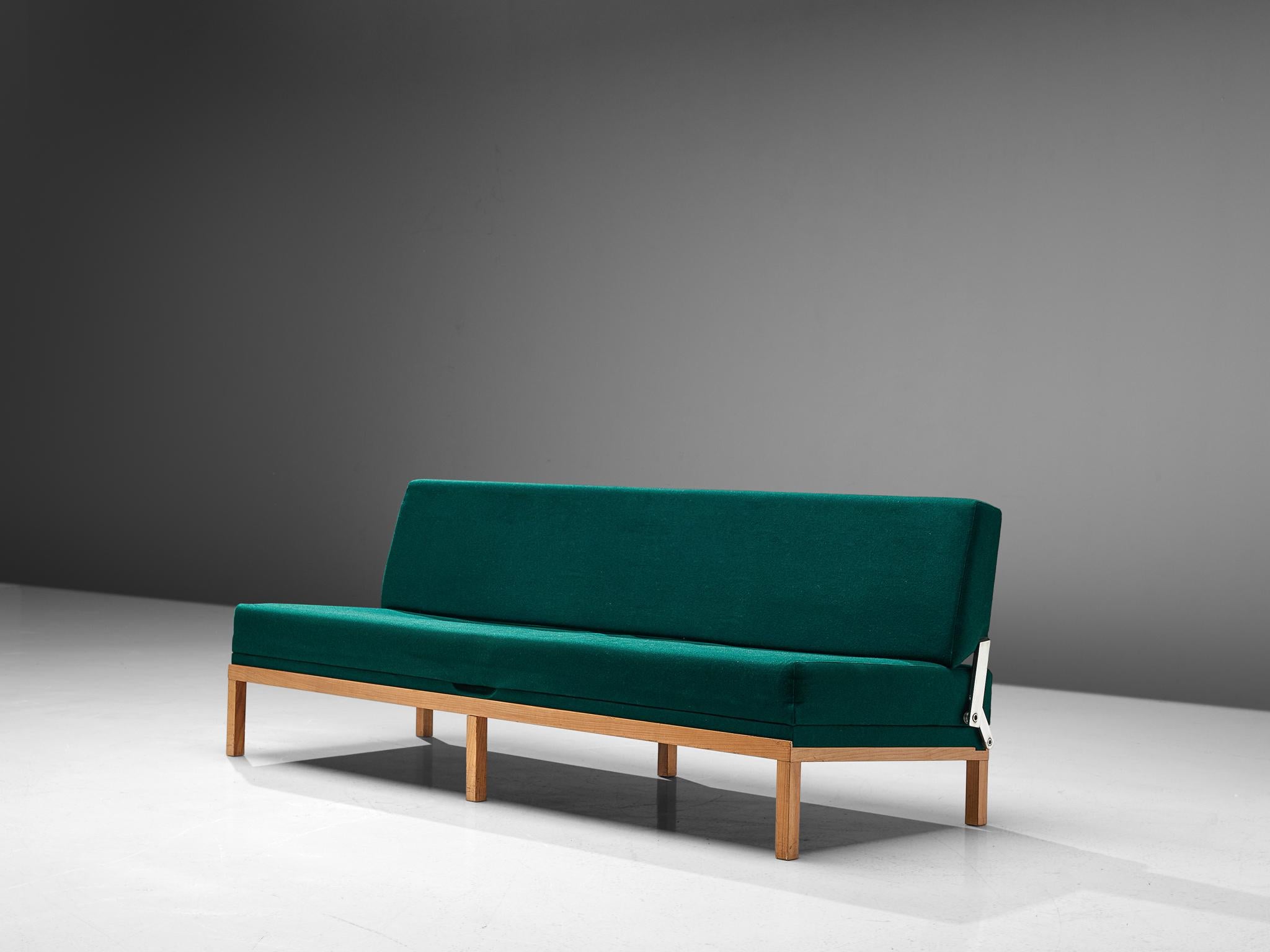 Johannes Spalt for Wittmann, green fabric, teak, Austria, 1960s.

This Austrian daybed is named 'Constanze'. This early model, with teak frame and green upholstery is wonderfully balanced in its color palette. The elegant slim legs create an open