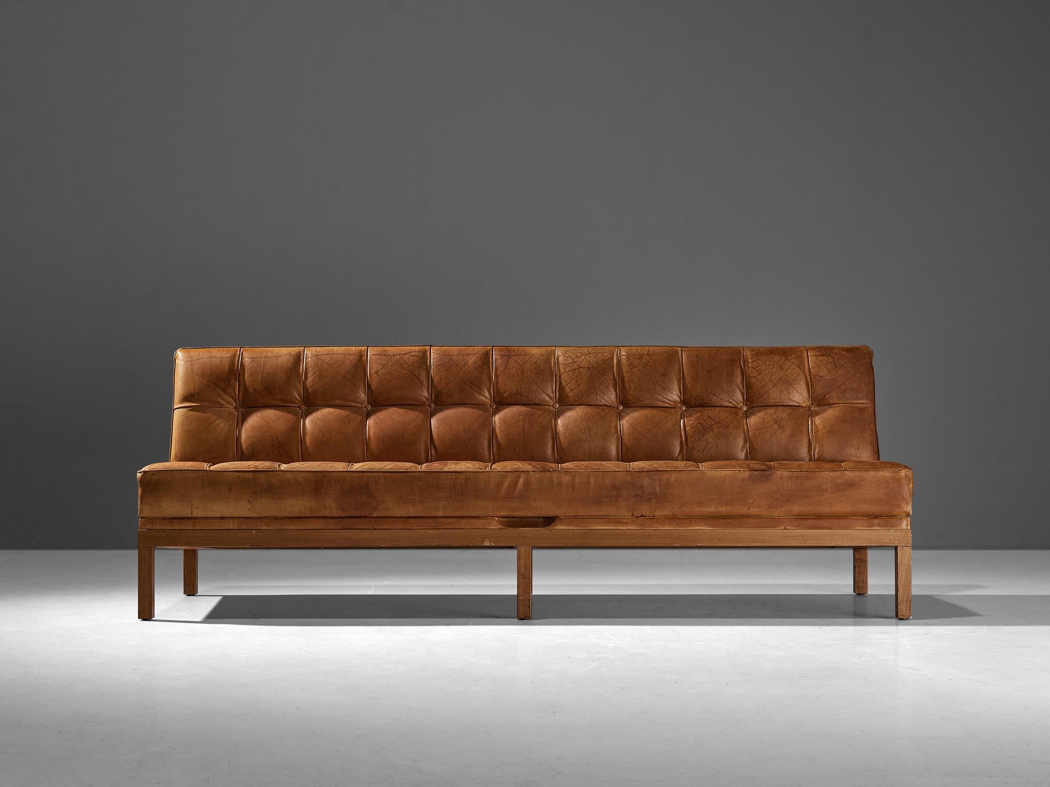 Johannes Spalt for Wittmann, cognac leather, teak, Austria, 1960s.

This Austrian daybed is named 'Constanze'. This item is designed by Johannes Spalt and manufactured by Wittmann. This early model, with teak frame and cognac leather is wonderfully
