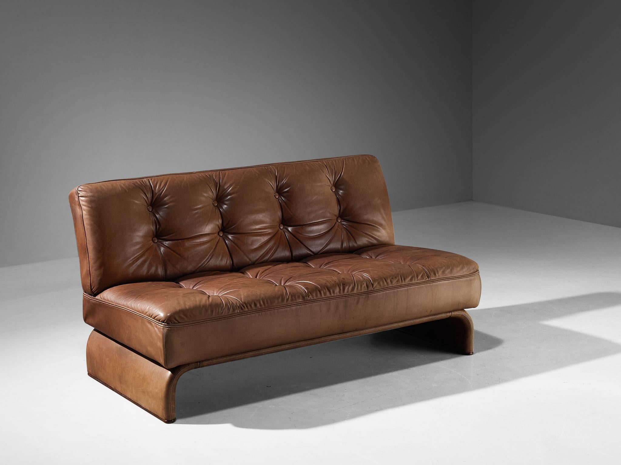 Johannes Spalt for Wittmann, 'Constanze' daybed or sofa, cognac leather, metal, Austria, 1960s. 

This sofa or daybed, designed by architect Johannes Spalt, is typical for mid-century modern design from Austria of the 1960s. The tufted cognac