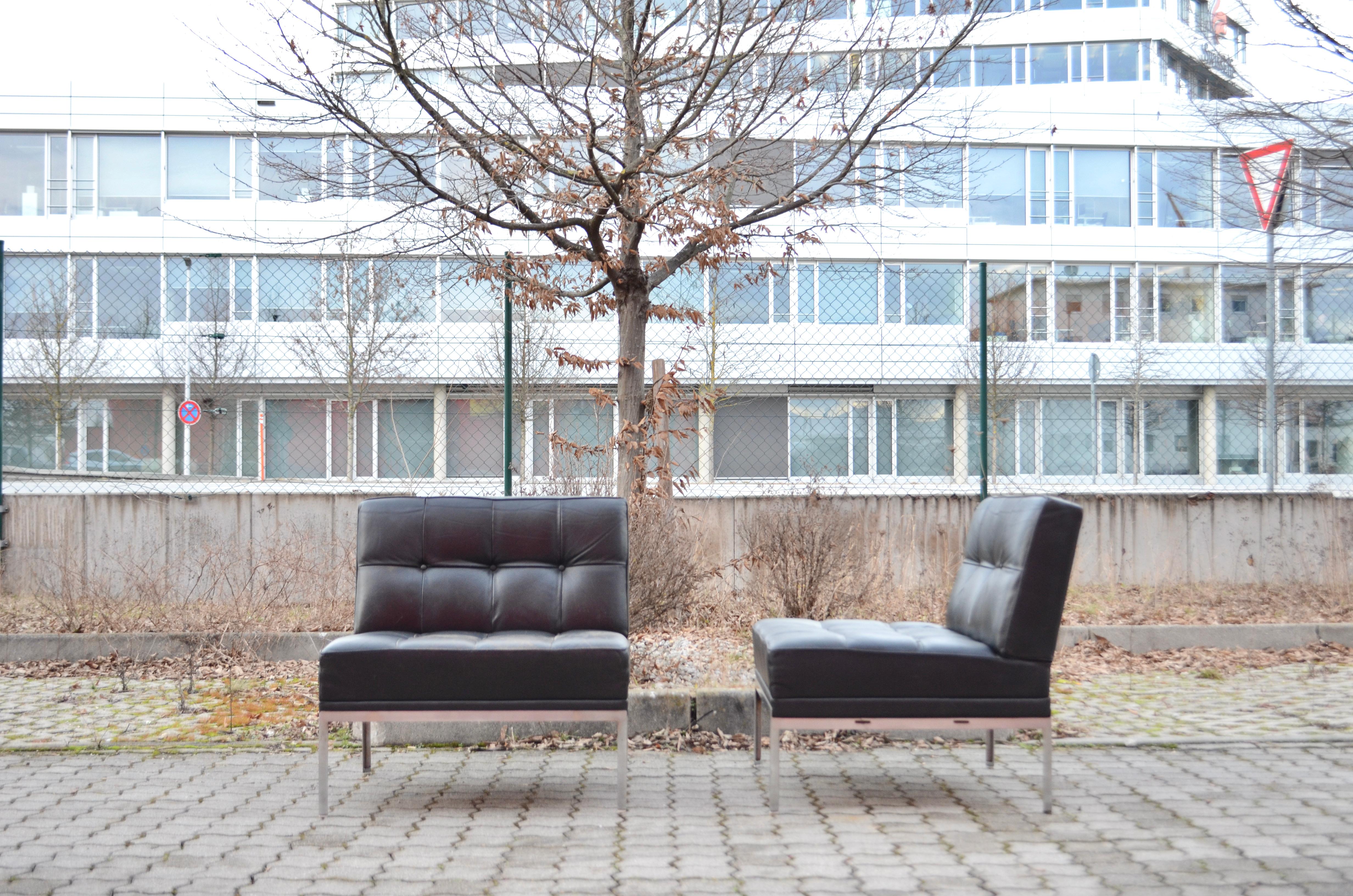 The easy lounge chairs Model Constanze by Austrian architect Johannes Spalt for Wittmann. 
Its fits well to the Constanze daybed.
A classic mid century Design in tufted design.
Produced in the 1960s.
Chrome frame and Black Aniline leather. 
1