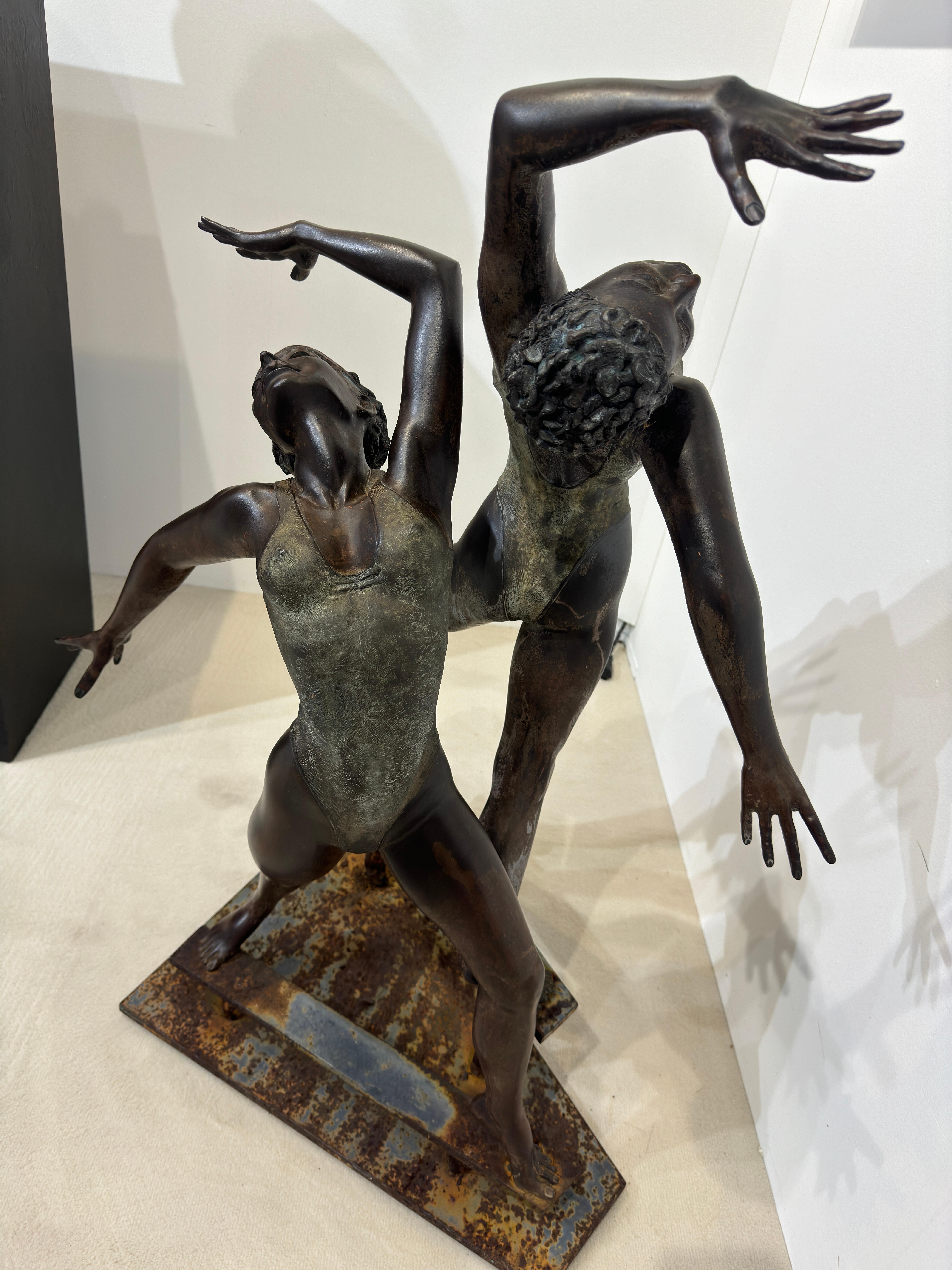 Two Dancers Bronze Sculpture

Artist signed, artist proof, the sculpture stands on a steel base made to be place in the garden, original patina. 
John Ake American artist born 1922-1989. 