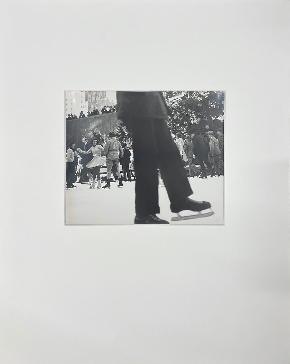 Rockefeller Center (skate) - Vintage Print, New York City, Ice Skaters, Winter - Photograph by John Albok