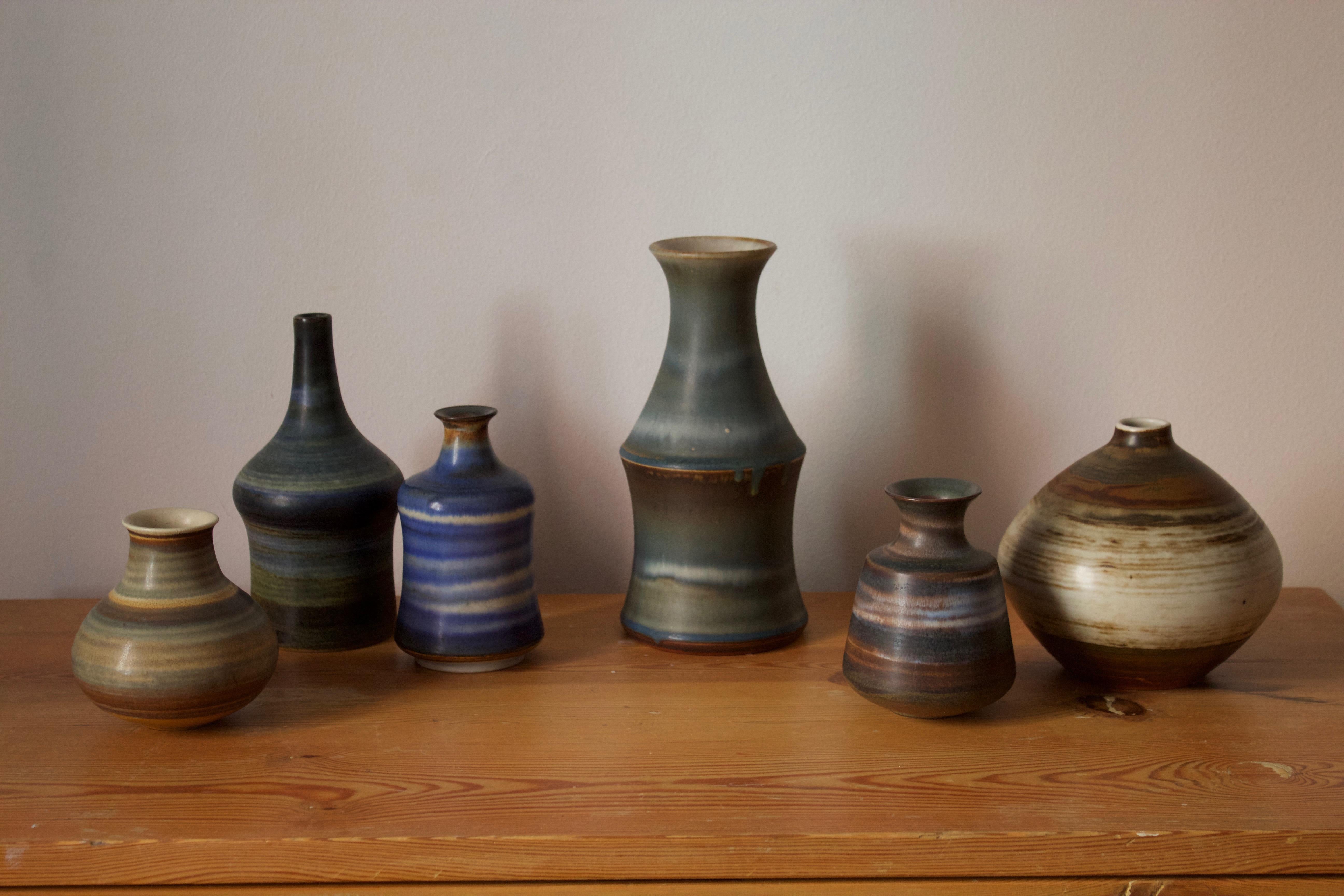 A set of six studio vases, designed by John Andersson (Swedish, 1899-1969). Produced by Höganäs Keramik. Signed.

Other ceramicists of the period include Axel Salto, Carl Harry-Stålhane, Bernt Friberg and Arne Bang.