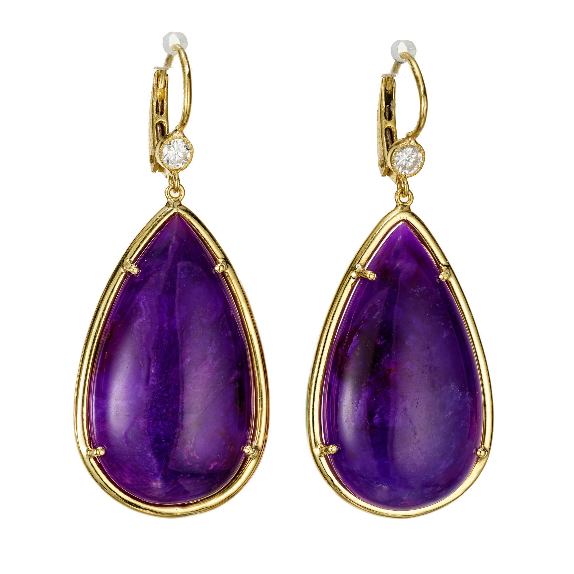 Designer John Apel large bright purple sugalite and diamond earrings. 2 pear shaped bluish purple sugalites set in 20k yellow gold with 2 round accent diamonds.  

2 pear shape bluish purple cabochon sugalite, 30.5mm x 17.75mm x 6.1mm
2 round