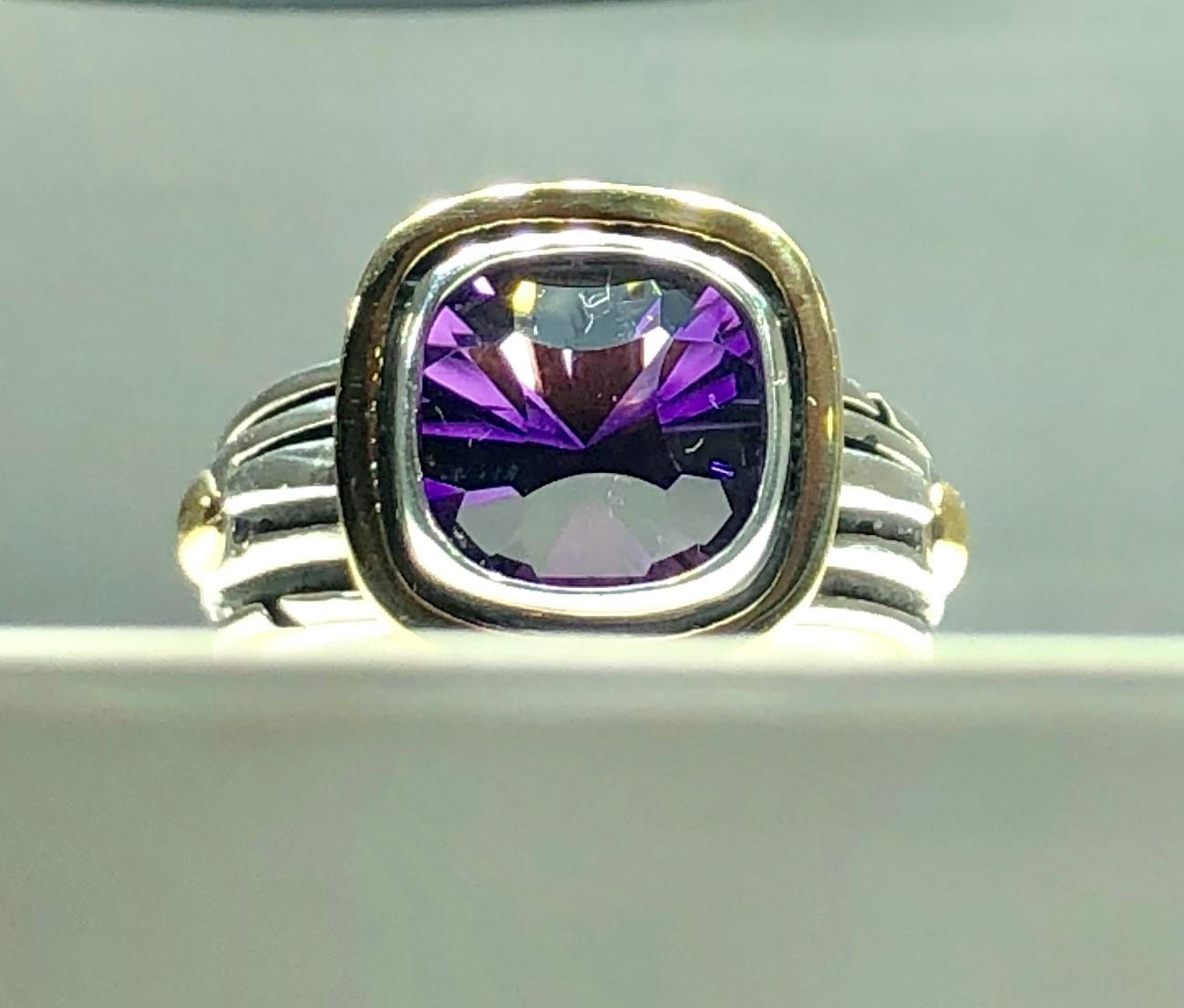 John Atencio 18 karat Sterling Amethyst cocktail ring. John Atencio design created in 18 karat and sterling, weighs10.5 grams. Amethyst center stone measures 9mm by 9.22 mm, cushion fancy cut. Ring size 7, ring can be sized in house upon purchase