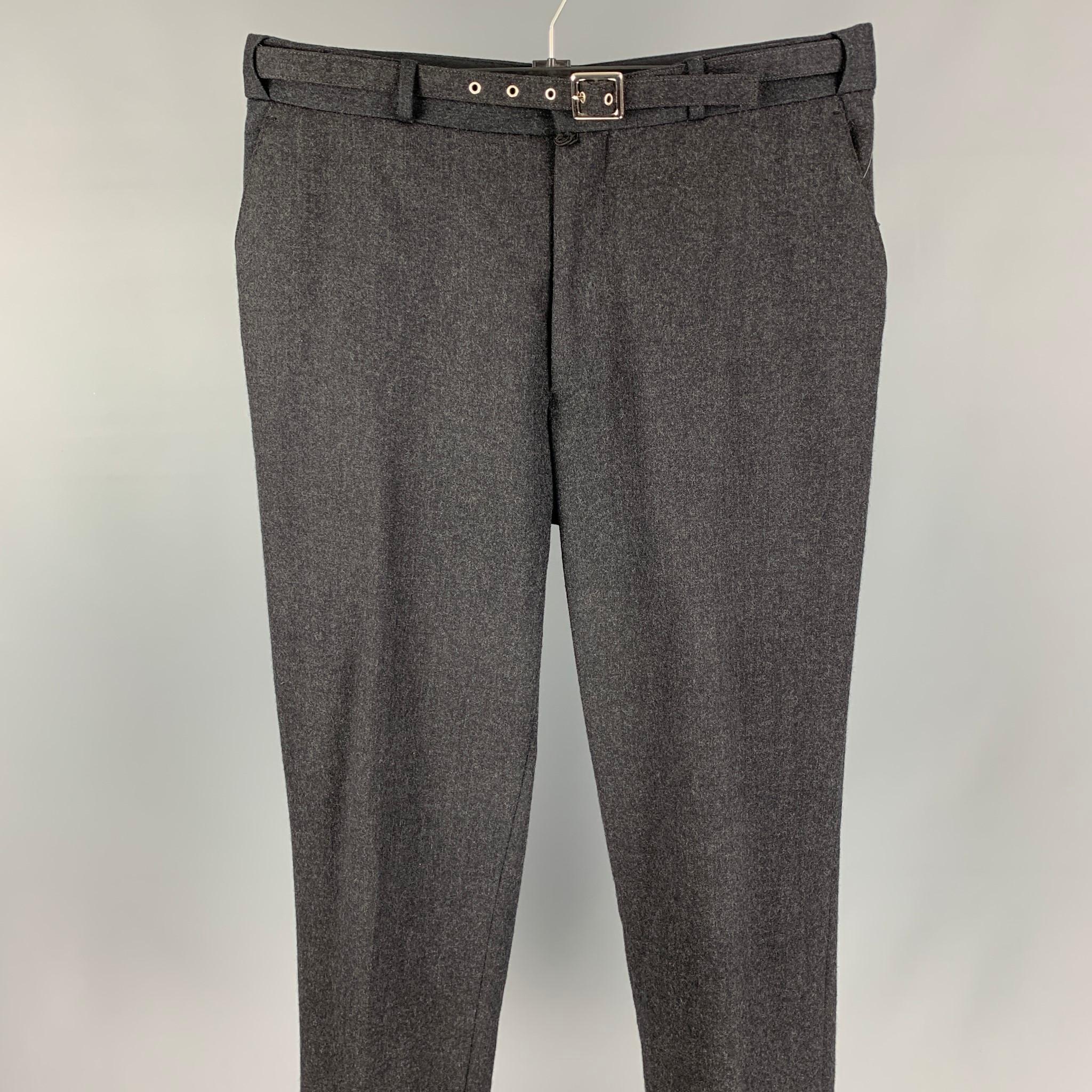 JOHN BARTLETT dress pants comes in a charcoal wool / lycra featuring a self belt detail, flat front, front tab, and a zip fly closure. Made in Italy. 

Very Good Pre-Owned Condition.
Marked: 50

Measurements:

Waist: 32 in.
Rise: 10.5 in.
Inseam: 31