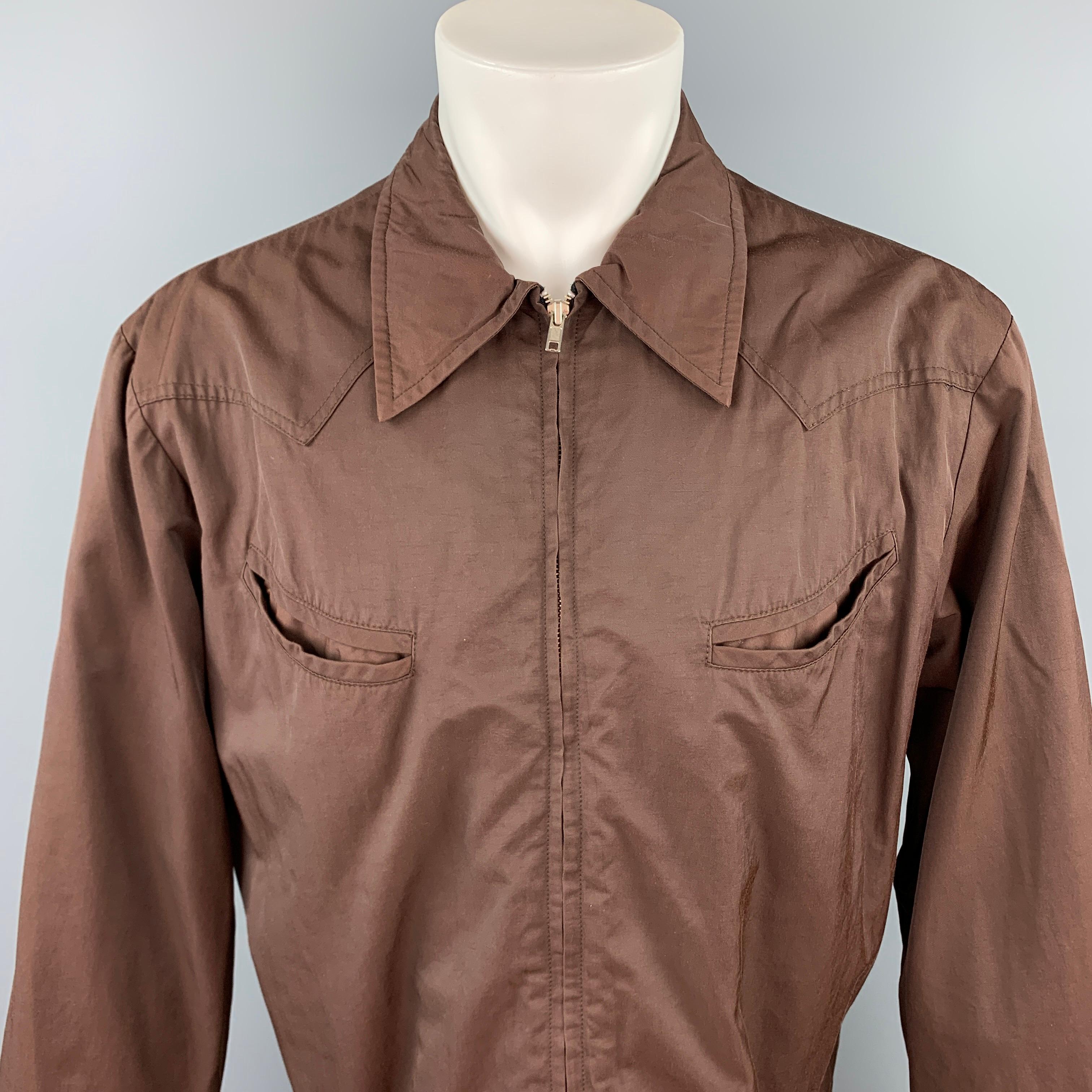 JOHN BARTLETT jacket comes in a brown cotton / nylon featuring a pointed collar, slit pockets, and a zip up closure. Made in USA.

Very Good Pre-Owned Condition.
Marked: 4

Measurements:

Shoulder: 20 in.
Chest: 48 in.
Sleeve: 26 in.
Length: 23.5