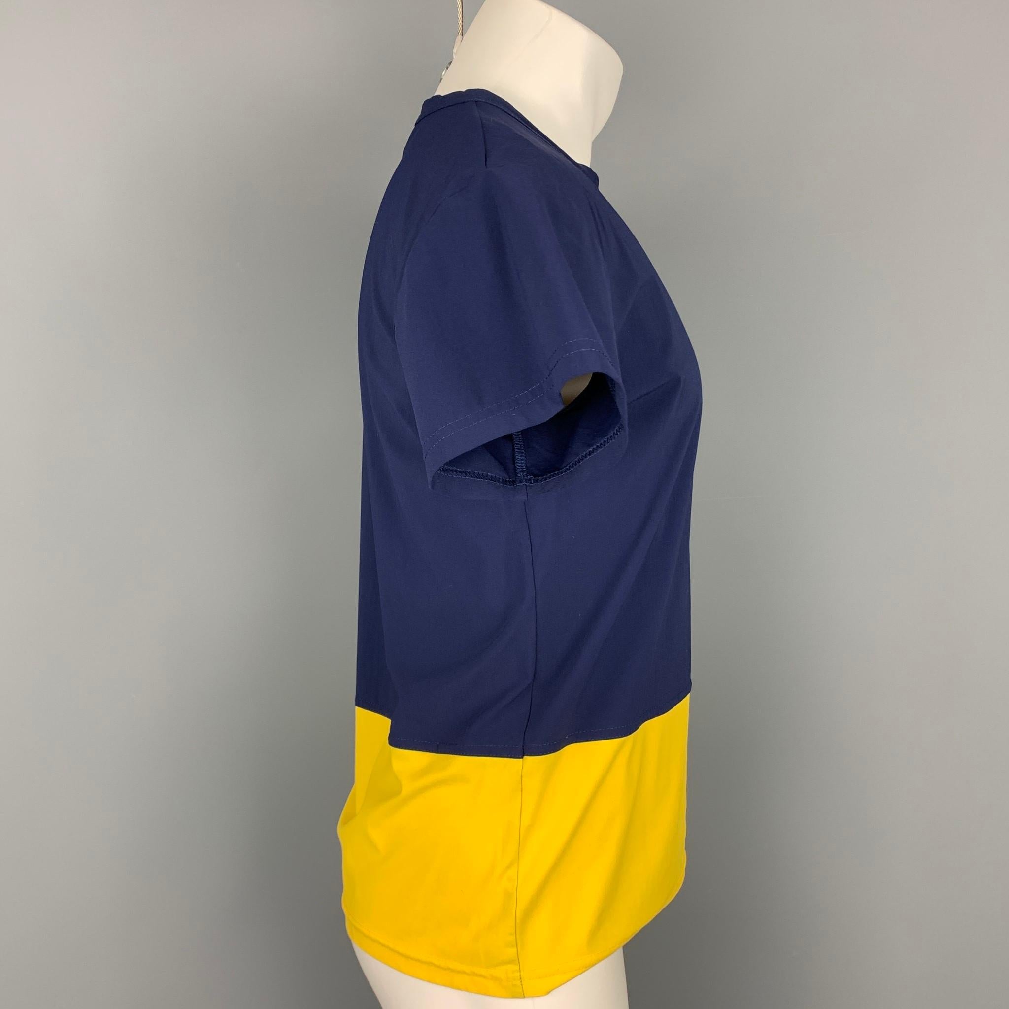 JOHN BARTLETT t-shirt comes in a blue & yellow color block polyamide featuring a slim fit and a crew-neck. Made in Italy.

Very Good Pre-Owned Condition.
Marked: IT 54

Measurements:

Shoulder: 20 in.
Chest: 40 in.
Sleeve: 6 in.
Length: 24.5 in. 
