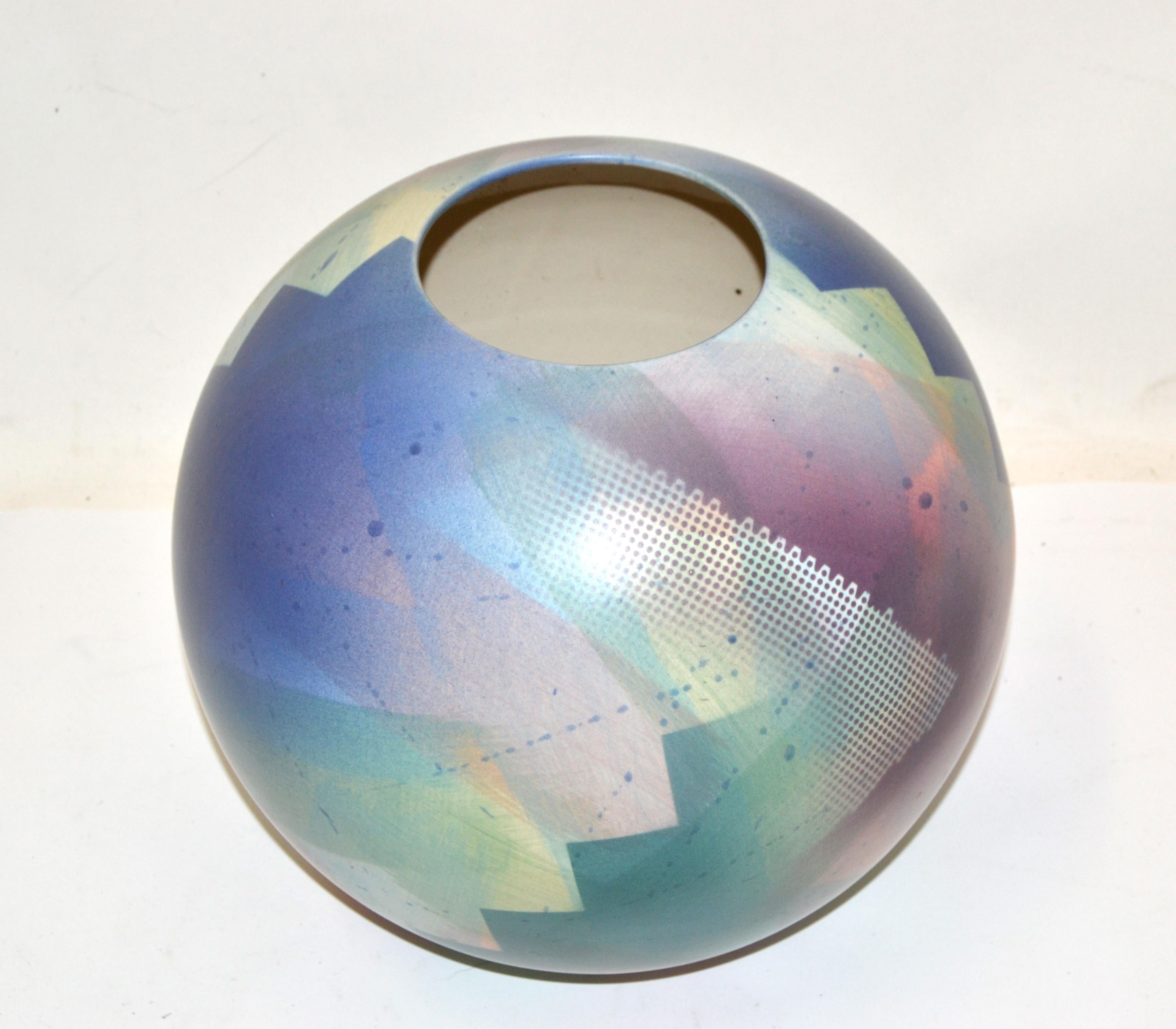 Marked and Numbered John Bergen Studio Canada round Ceramic Vase, Vessel made in the 1980.
Hand-painted and glazed in mellow pastel colors. 
The opening measures 4.75 inches in Diameter.
Marked at the base with foil label and JB V 91.