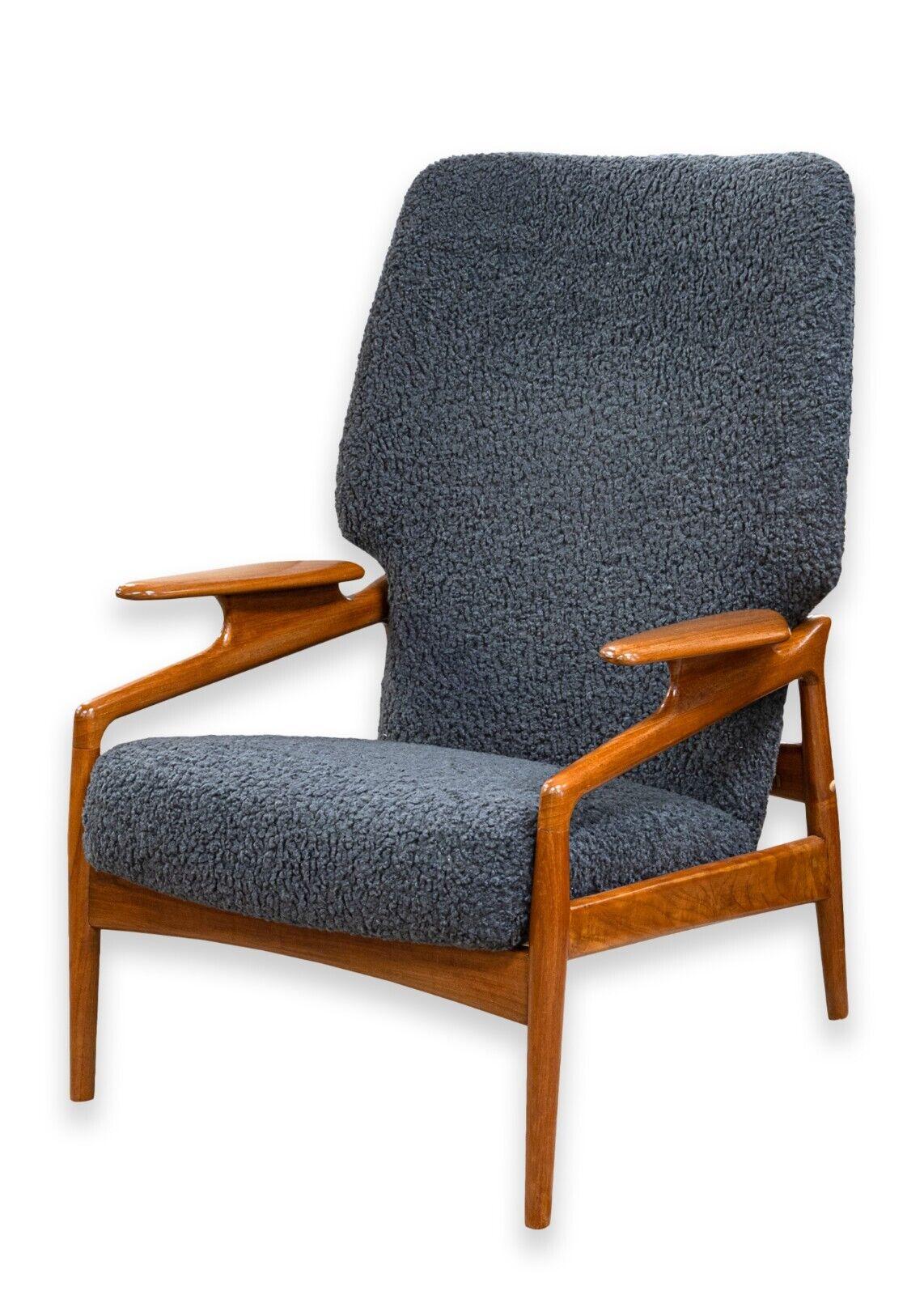 A John Bone for Mikael Laursen lounge chair. A beautiful piece of functional art from the 1950s. This lounge chair features a gorgeous sculpted teak wood frame designed by John Bone, and cozy wool cushions with a deep blue slate coloring. This chair