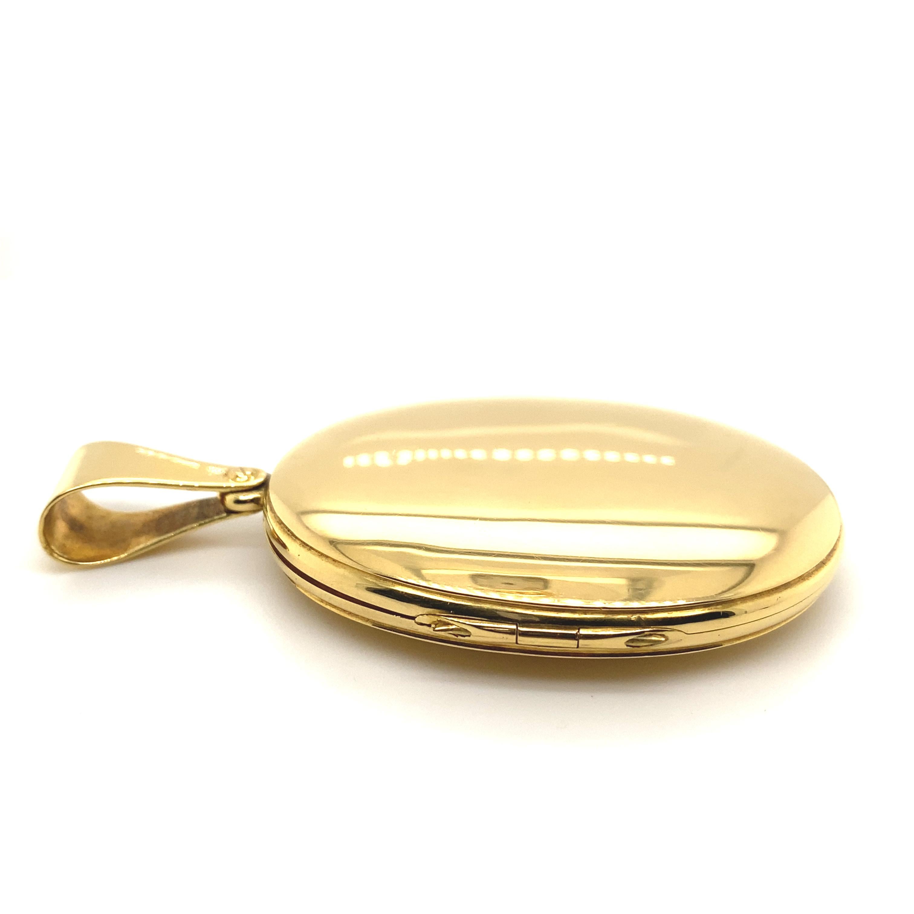 An oval locket in 18 karat yellow gold by John Brogden, circa 1870

A larger sized oval locket in 18 karat yellow gold, in a plain polished finish opening to reveal two halves lined with the original silk and fitted glass panels in which to place a