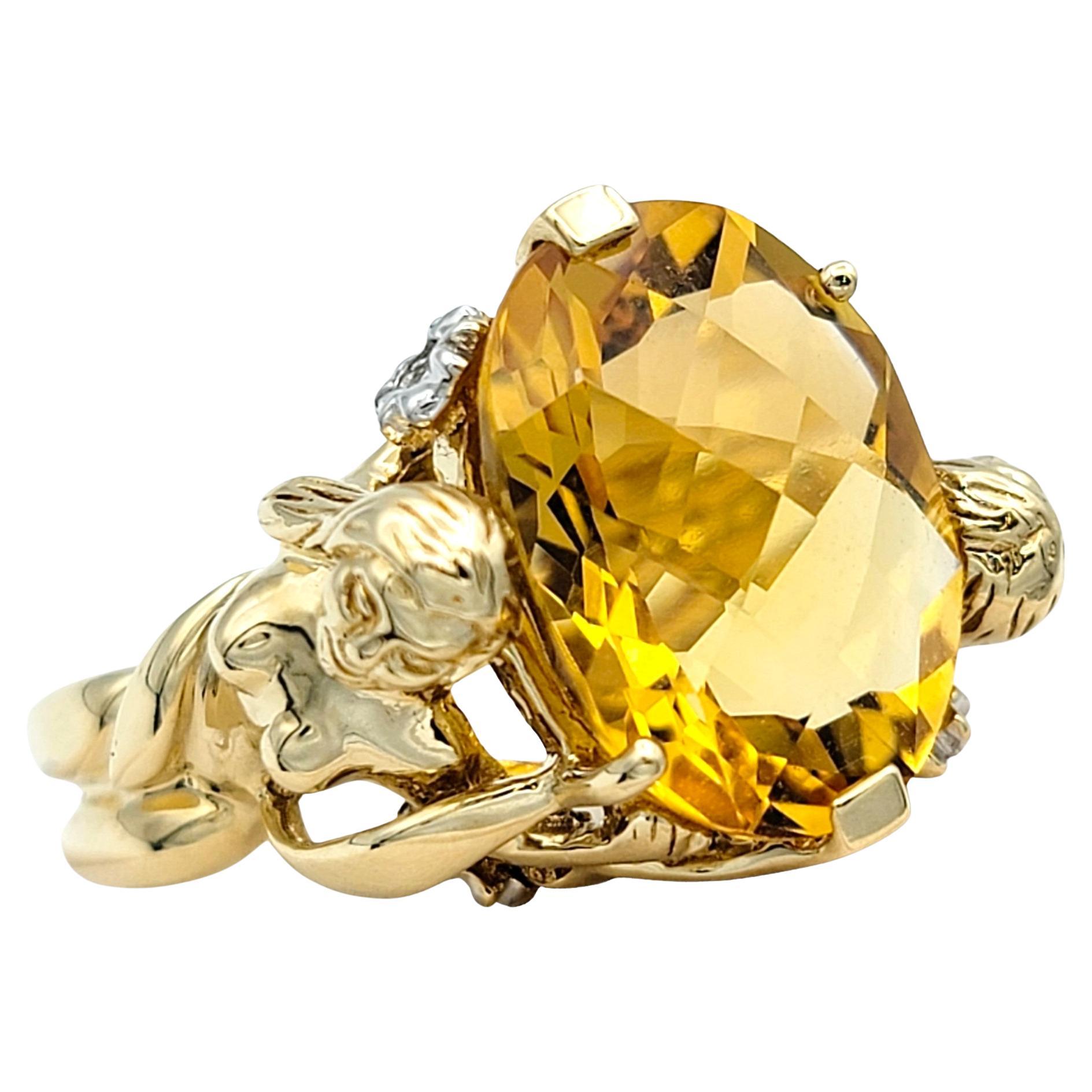 John C. Rinker Oval Citrine Cocktail Ring with Two Lady Carving in 14 Karat Gold For Sale