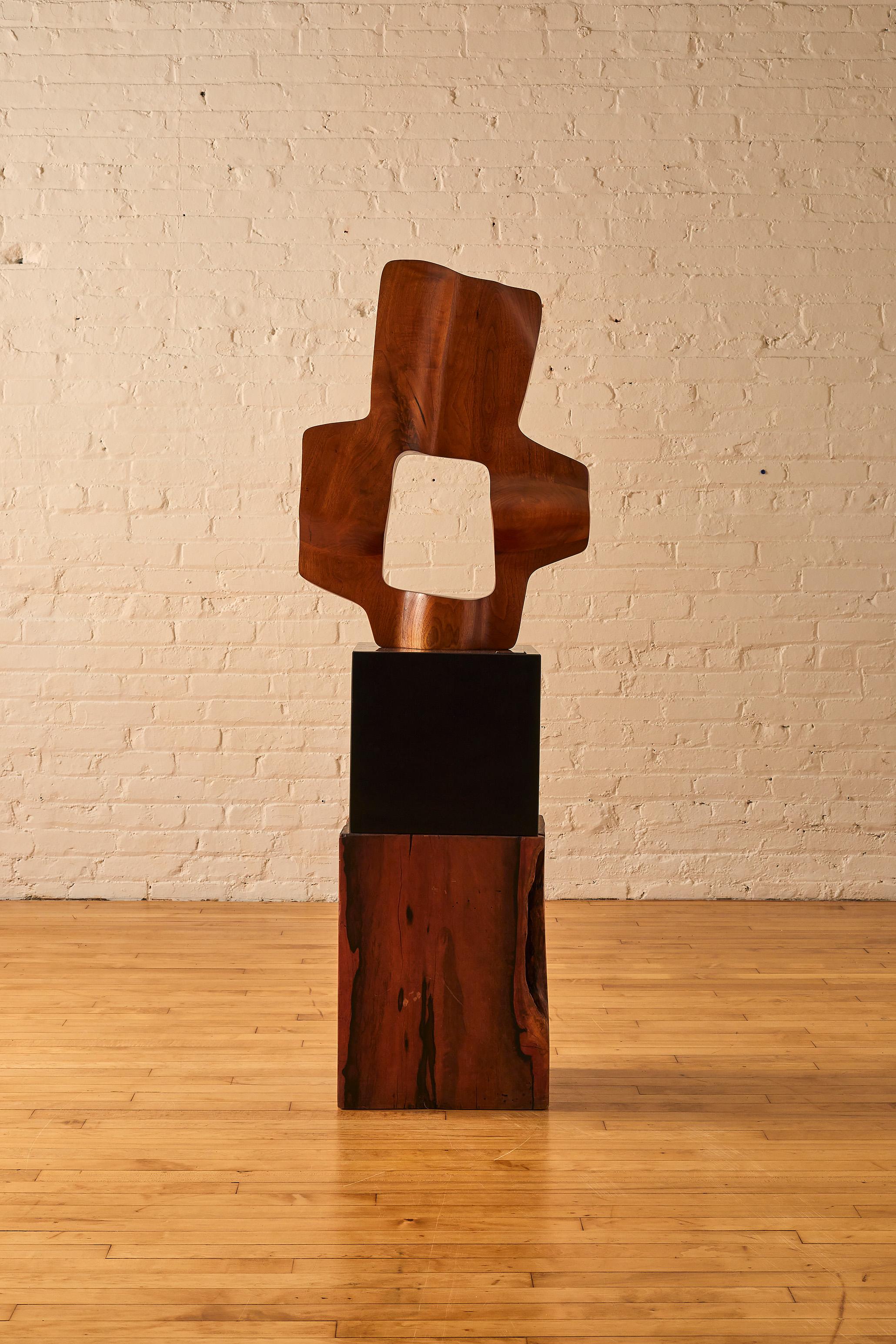 John Campbell laminated walnut sculpture, signed with a studio plaque on the base.

