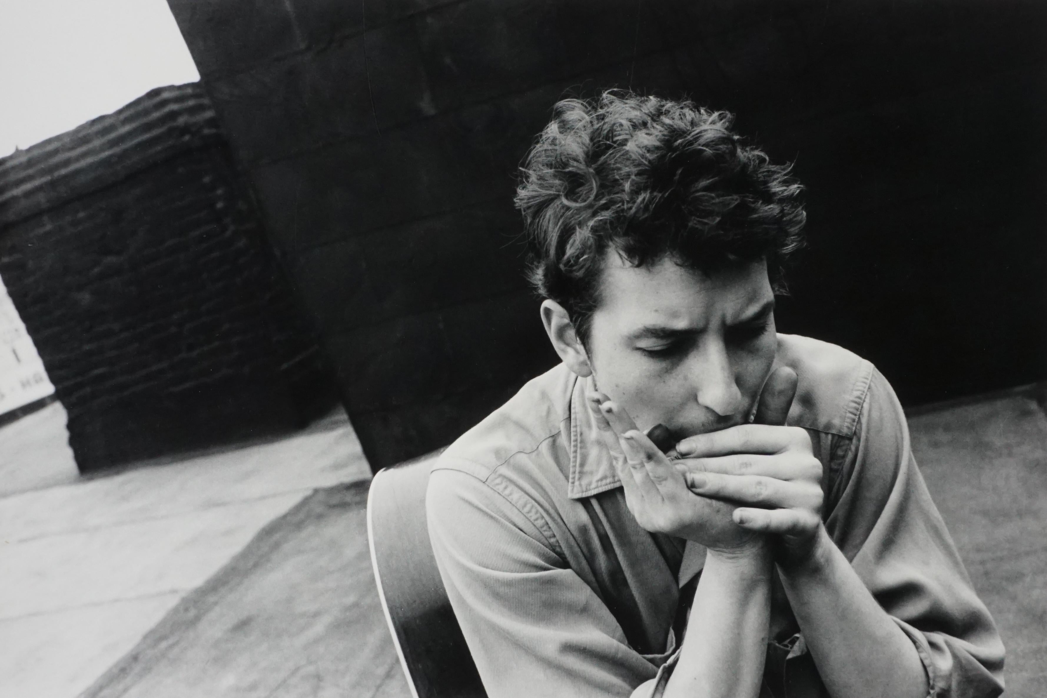 John Cohen Black and White Photograph - Bob Dylan on My Rooftop (playing harmonica), 1962
