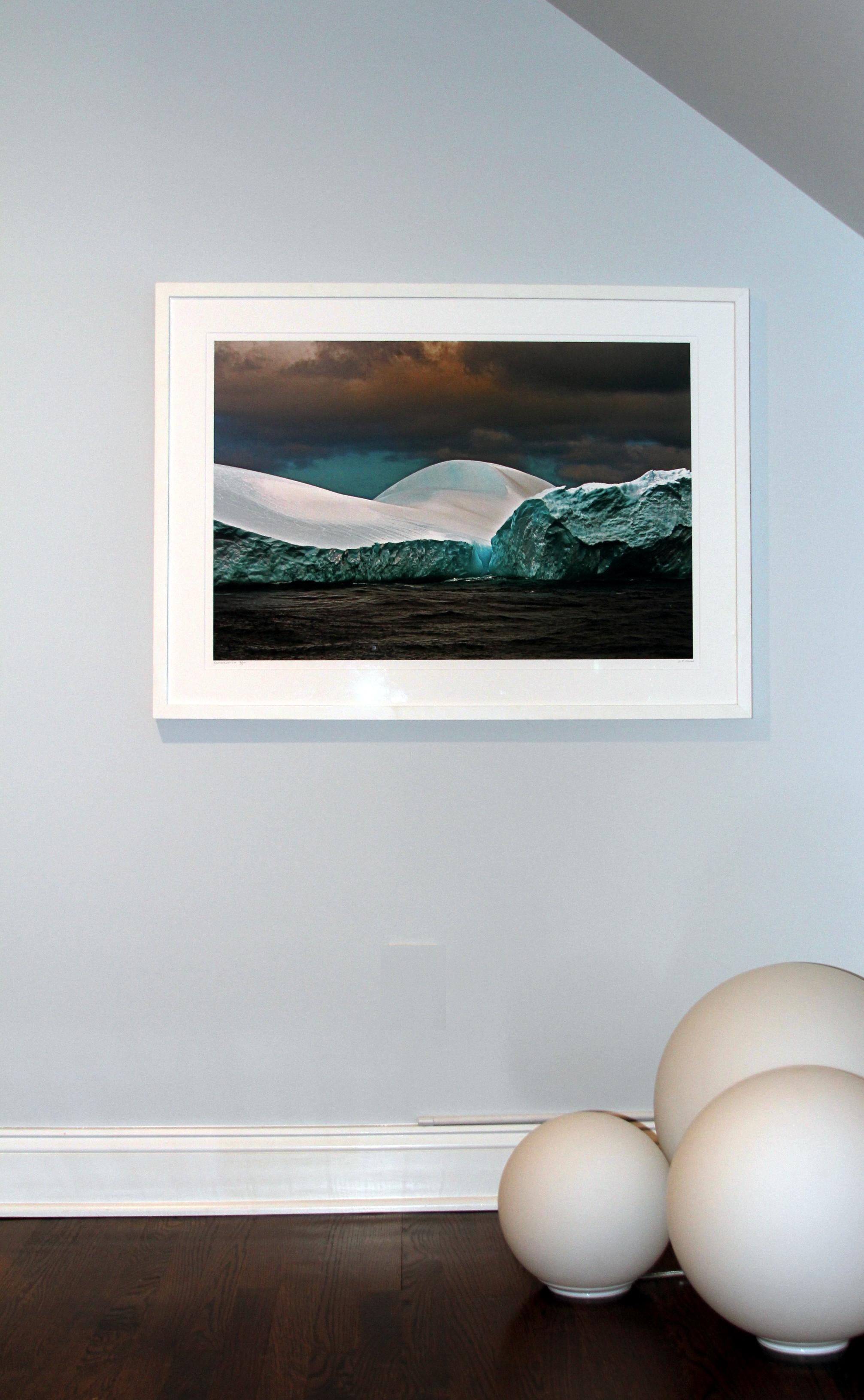 Antarctica #121 is a limited edition photograph which is part of the Antarctica/Patagonia Series by John Conn taken in 2010.  The image is 20x30 printed on 24x36 archival paper.  It is currently framed in a white frame.  It is an edition of 5. The