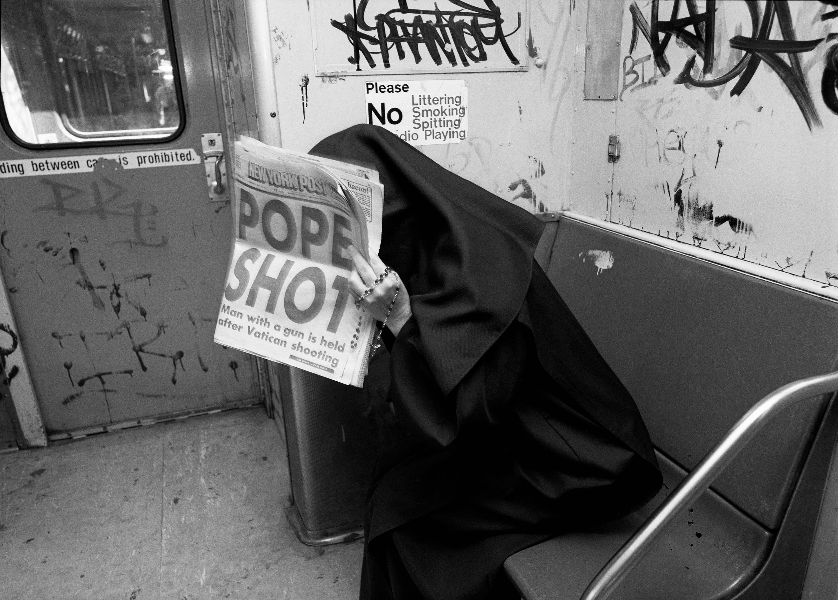 John Conn Figurative Photograph - Nun, Subway, Black and White Limited Edition Photograph, NYC, 1970s, 1980s