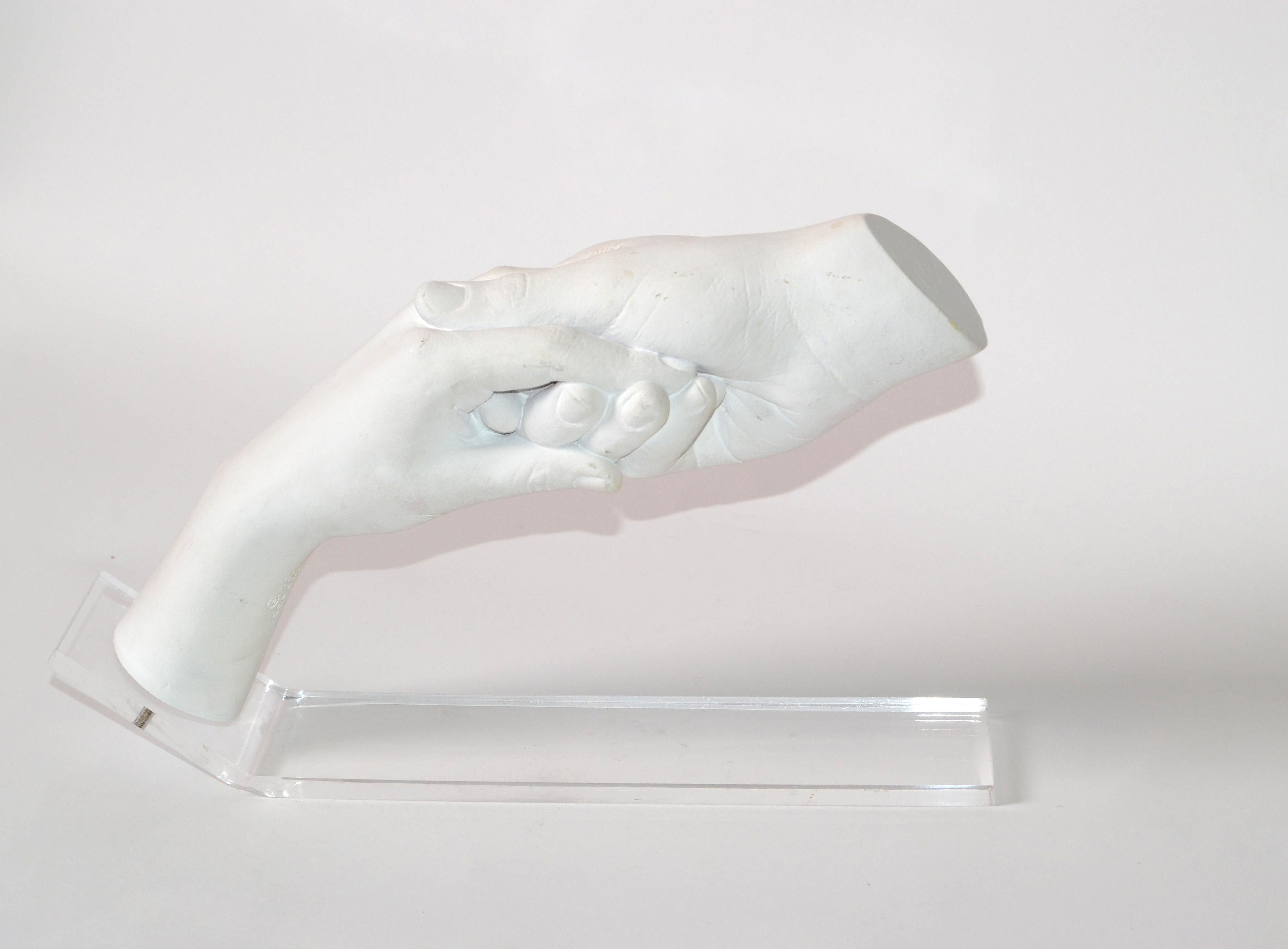 A Mid-Century Modern plaster table sculpture of a man and woman holding hands.
Mounted gracefully on a polished Lucite base.
The Artist-signed the sculpture with Cutrone, 1984.
Austin Prod. INC Trademark, dated 1984 at the wrist of the lady's