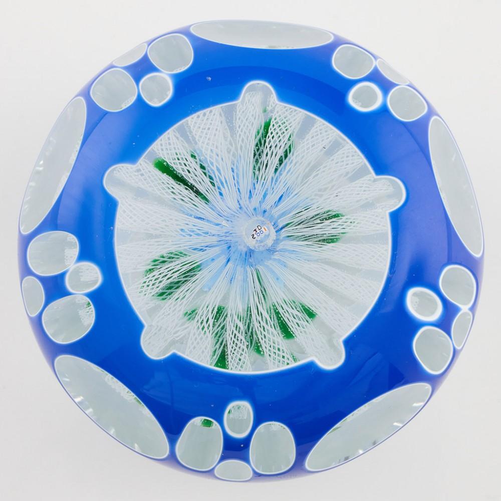 Heading : A John Deacons Lampwork Clematis On Muslin Overlay Paperweight 2001
Date : 2001
Origin : Scotland
Features : A lampwork Clematis flower, leaves and stem over a muslin ground with Double Cut and Faceted Overlay 
Marks : A JD2001 signature