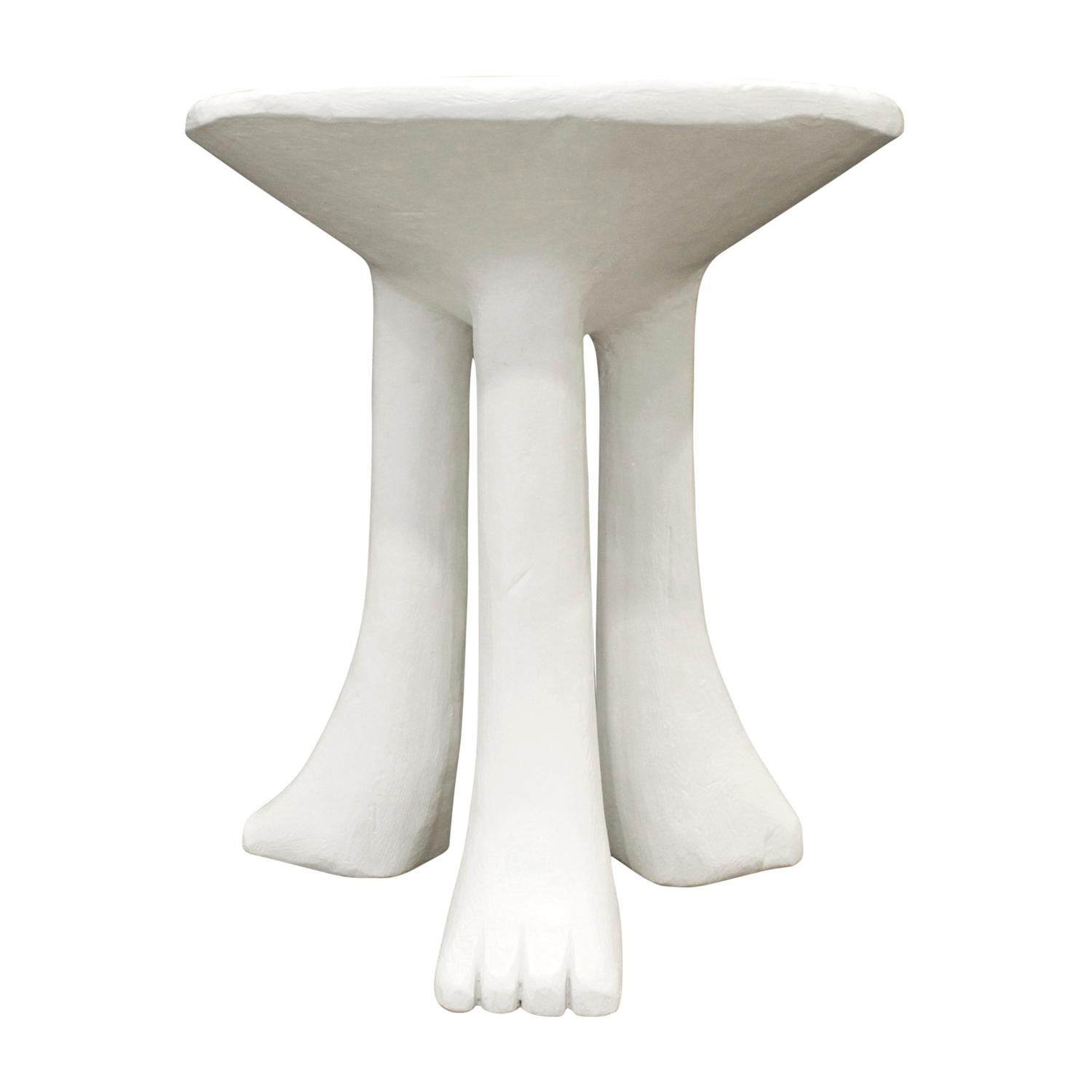 Rare and important 3 legged African end table, model 101-A, in plaster over rebar by John Dickinson, American circa 1980. This is a wonderful example of John Dickinson's iconic design. This piece is shown in the John Dickinson 1970s catalog.