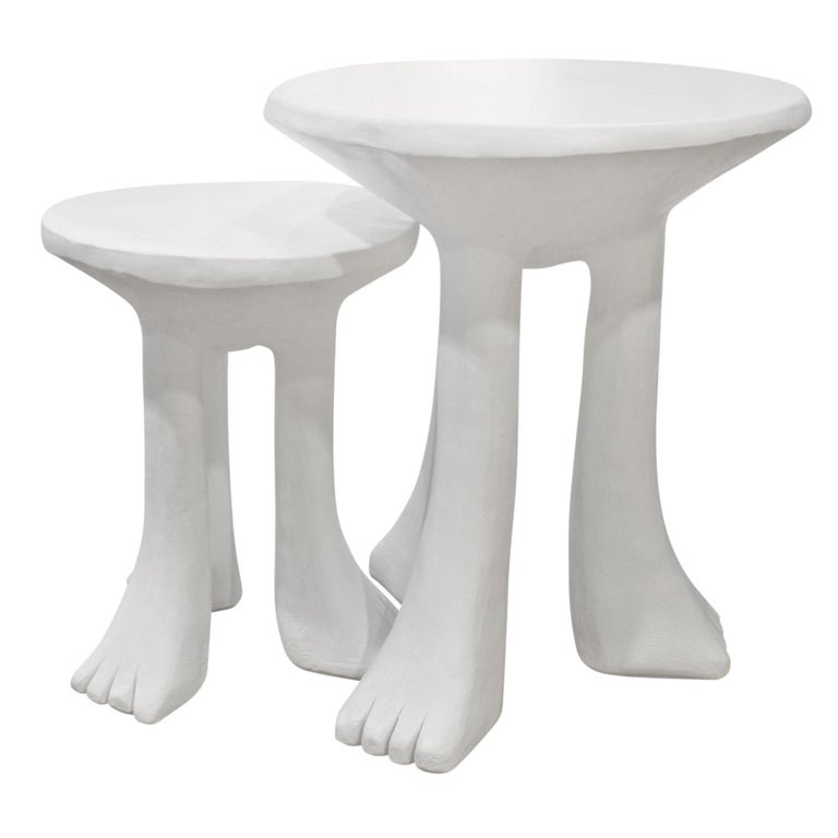 Pair of rare and important 3 legged African nesting tables, models 101-A and 101-B, in plaster by John Dickinson, American circa 1980. These are wonderful examples of John Dickinson's iconic designs. These are both shown in the John Dickinson 1970s