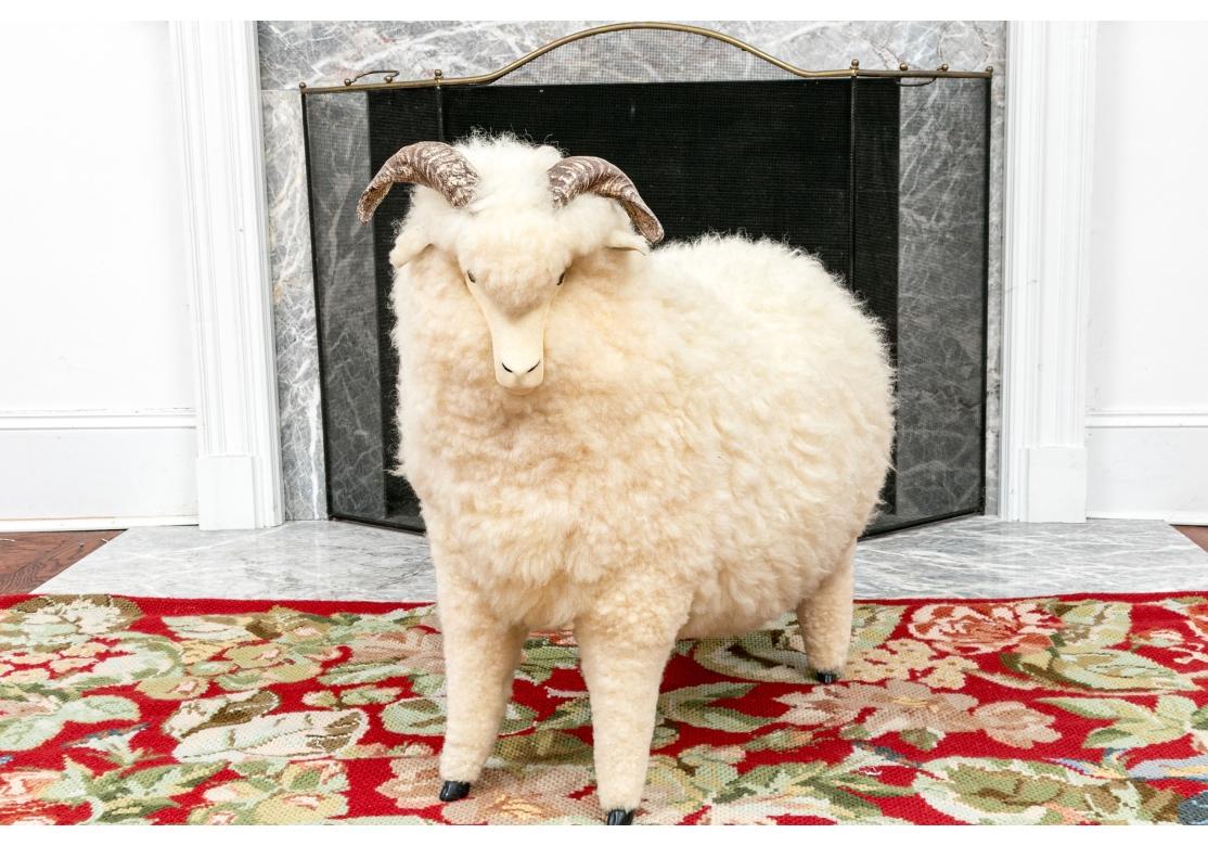 This life-size ram sculpture or ottoman, bench or footstool was designed by Joel Donahoe in Truckee, CA, in the 1980s and 90s. Known as the Lambkin benches, these were sold at design centers across the United States. In the style of Hans-Peter