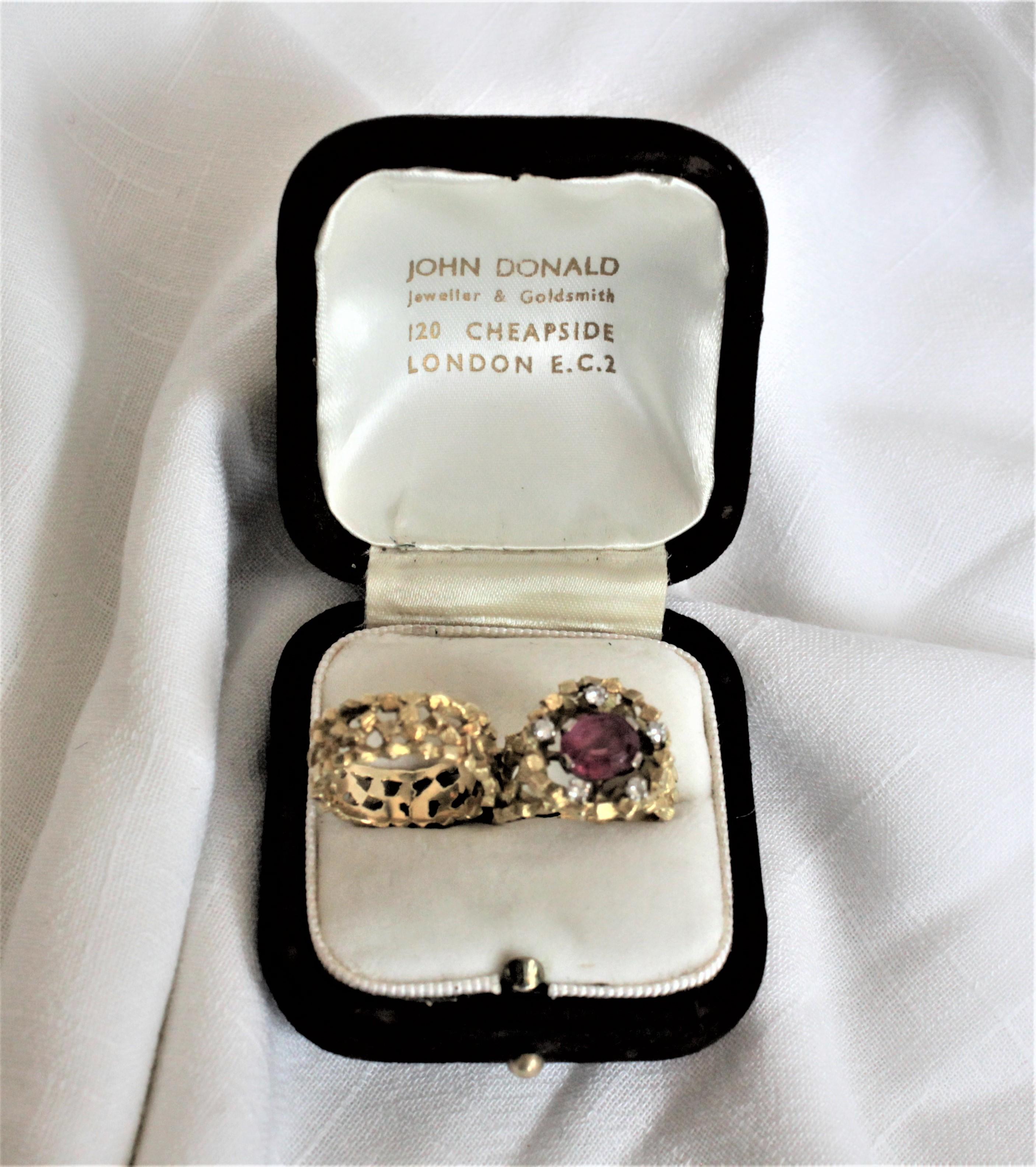 This matching 18-karat yellow and white gold and diamond engagement ring set was made by the renowned British jeweler, John Donald, who's creations are owned by such notable individuals as Princess Margaret and the Queen Mother in addition to having