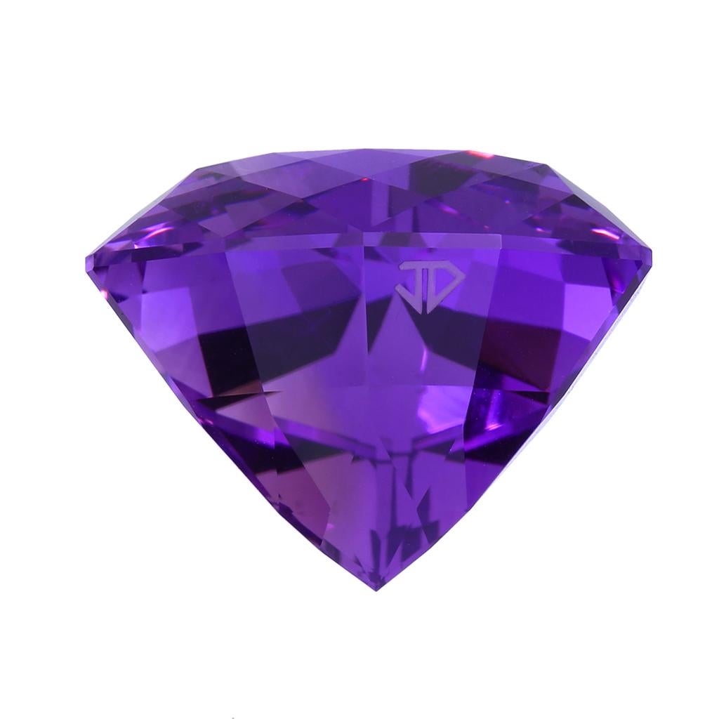 John Dyer is a highly awarded and acclaimed gemstone cutter and this 50.08ct amethyst is a showstopper that will be loved by any collector of fine gemstones or be placed in a custom setting to highlight this gem. Pictures don't do this gemstone