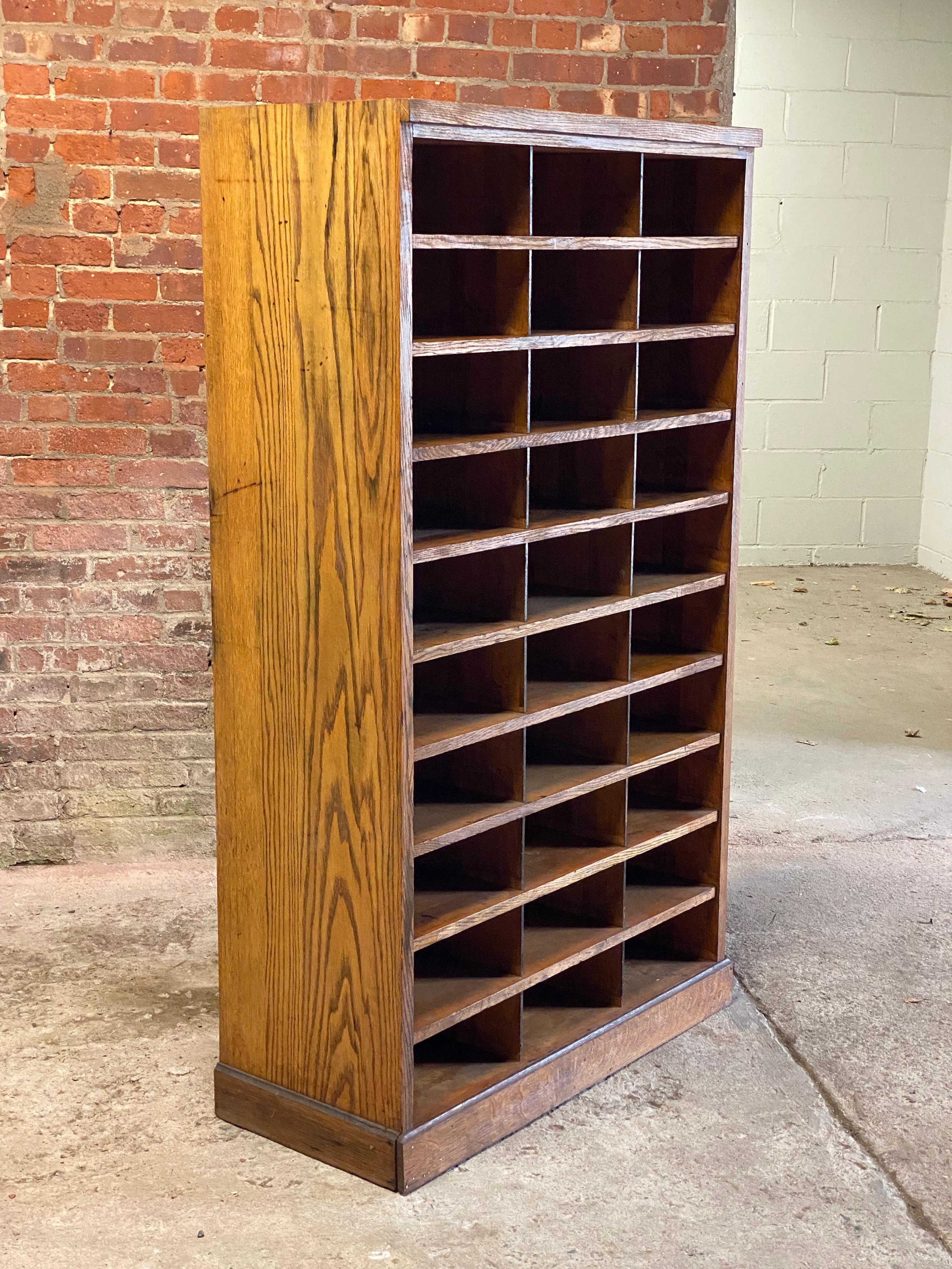 Heavy duty oak construction industrial office shelving. The piece consists of 30 cubby holes approximately 14.5