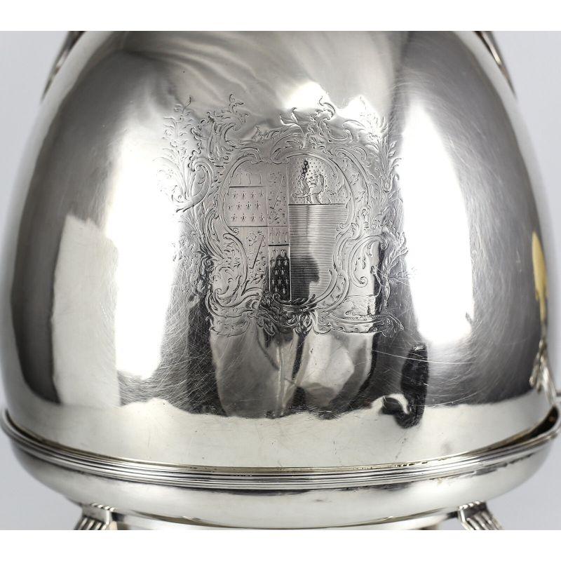 John Edwards III London sterling silver footed hot water kettle, George III 1790.

John Edwards III London sterling silver balled clawed feet hot water kettle, George III 1790. Two beautiful family crests or coat of arms adorning each side of the