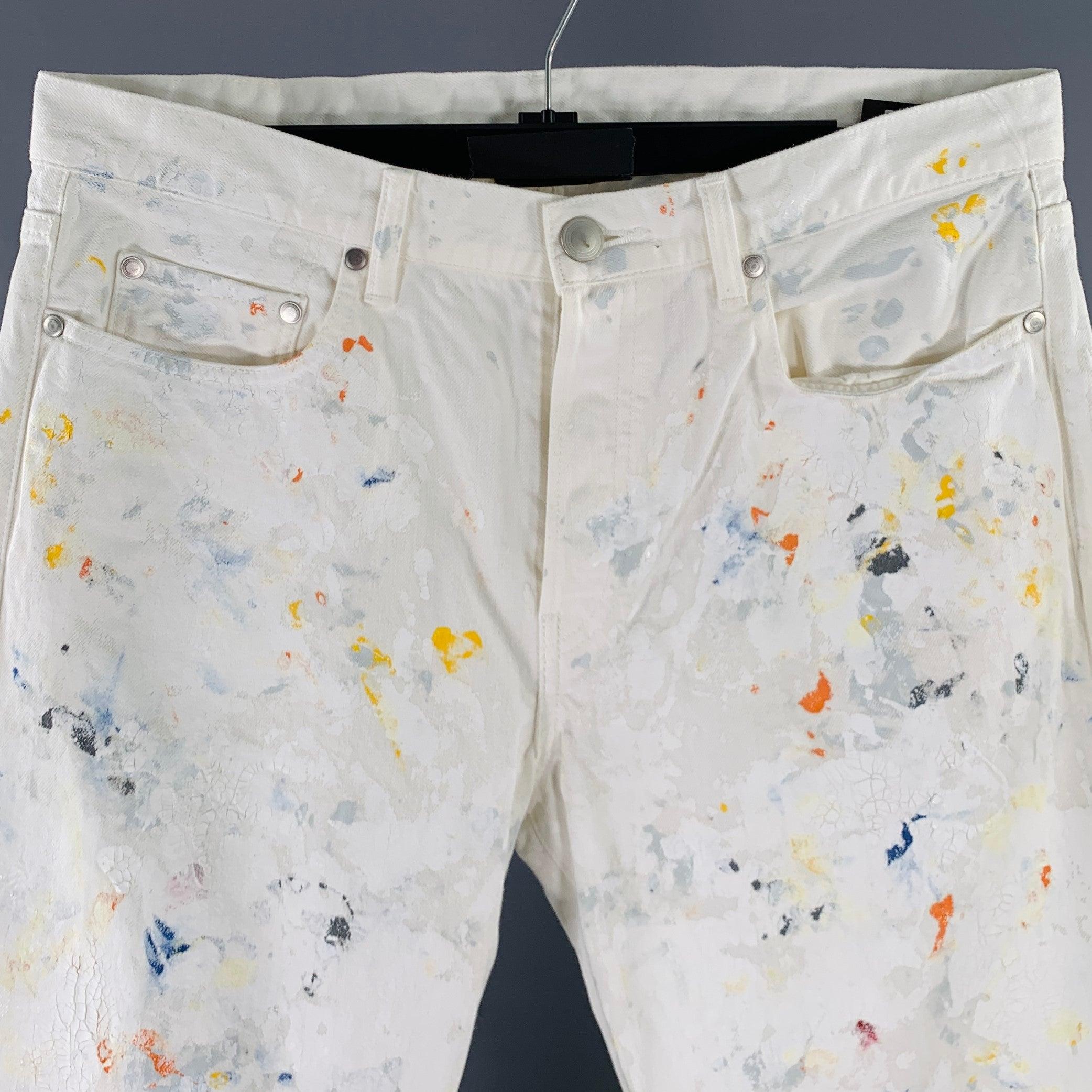 JOHN ELLIOTT jeans
in a white and multi-color cotton woven fabric featuring a five pockets style, paint splatter design and button fly closure. Made in Japan.Excellent Pre-Owned Condition. 

Marked:   33 

Measurements: 
  Waist: 33 inches Rise: 9.5