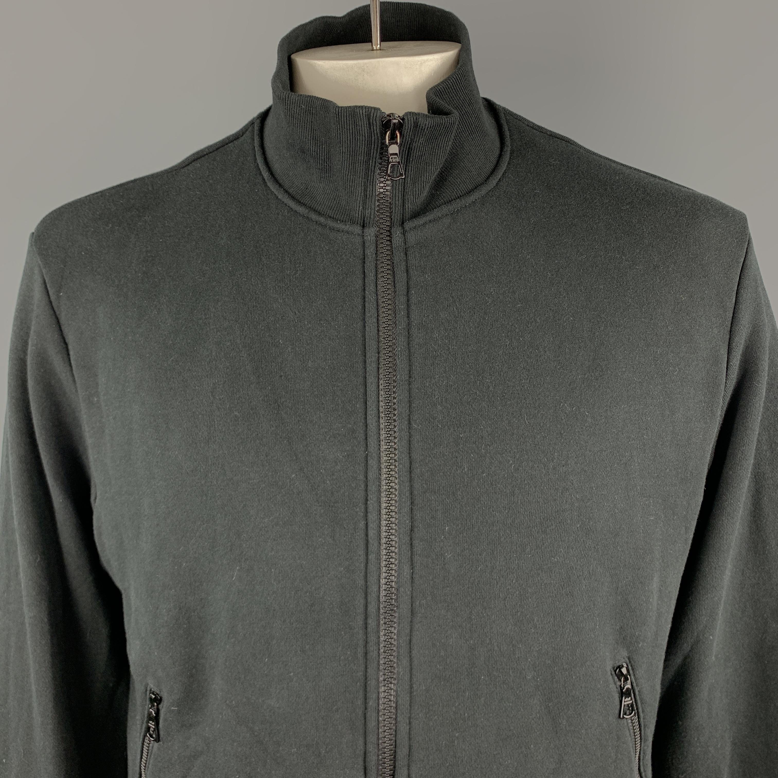 JOHN ELLIOTT Jacket comes in a black solid cotton material, with a high collar, zip pockets, trim at hem, ribbed high collar and cuffs, zip up. Made in USA.

Very Good Pre-Owned Condition.
Marked: 3 

Measurements:

Shoulder: 19 in. 
Chest: 47 in.