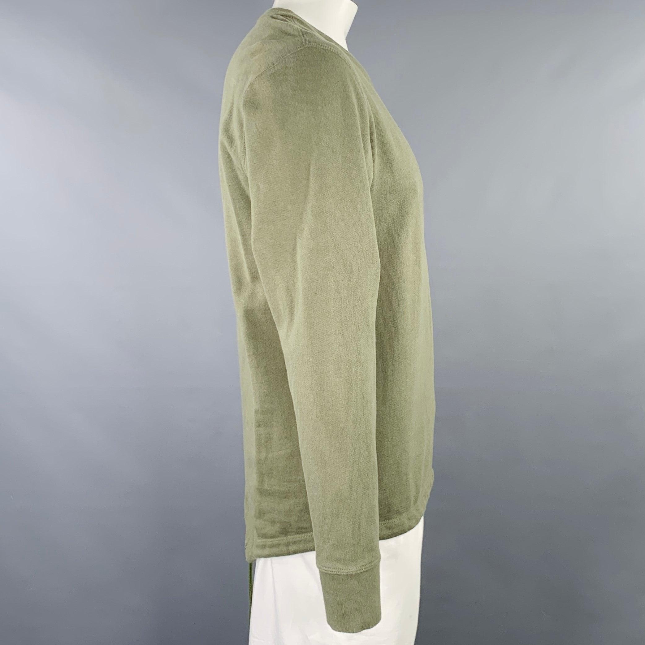 JOHN ELLIOTT sweatshirt
in a green cotton featuring back tassel details, long sleeves, and crew neck. Made in USA. in a Excellent Pre-Owned Condition. 

Marked:   3 

Measurements: 
 
Shoulder: 19 inches Chest: 42 inches Sleeve: 26 inches Length:
