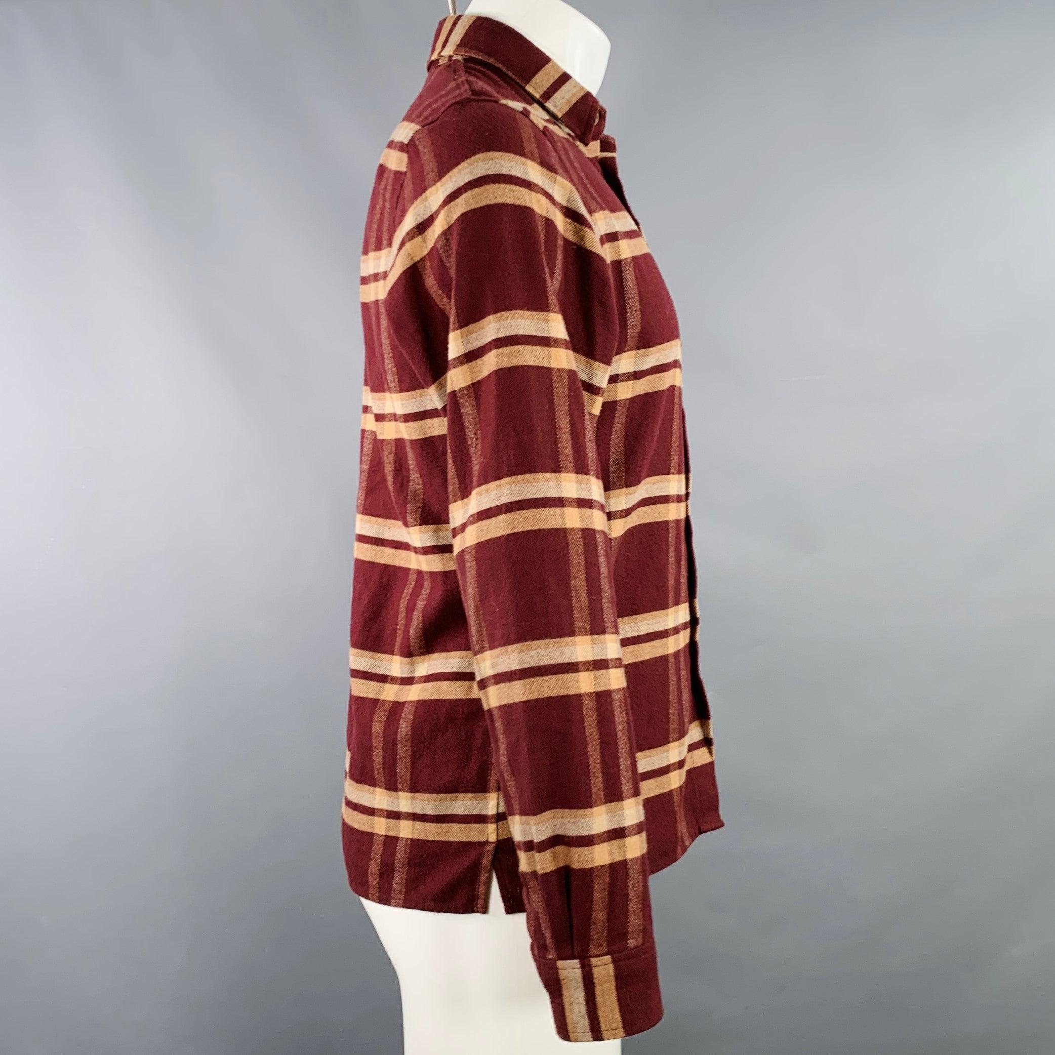 JOHN ELLIOTT long sleeve shirt
in a burgundy cotton woven fabric featuring a yellow plaid pattern, one pocket, and button closure. Very Good Pre-Owned Condition. Minor signs of wear. 

Marked:   1 

Measurements: 
 
Shoulder: 16.5 inches Chest: 40