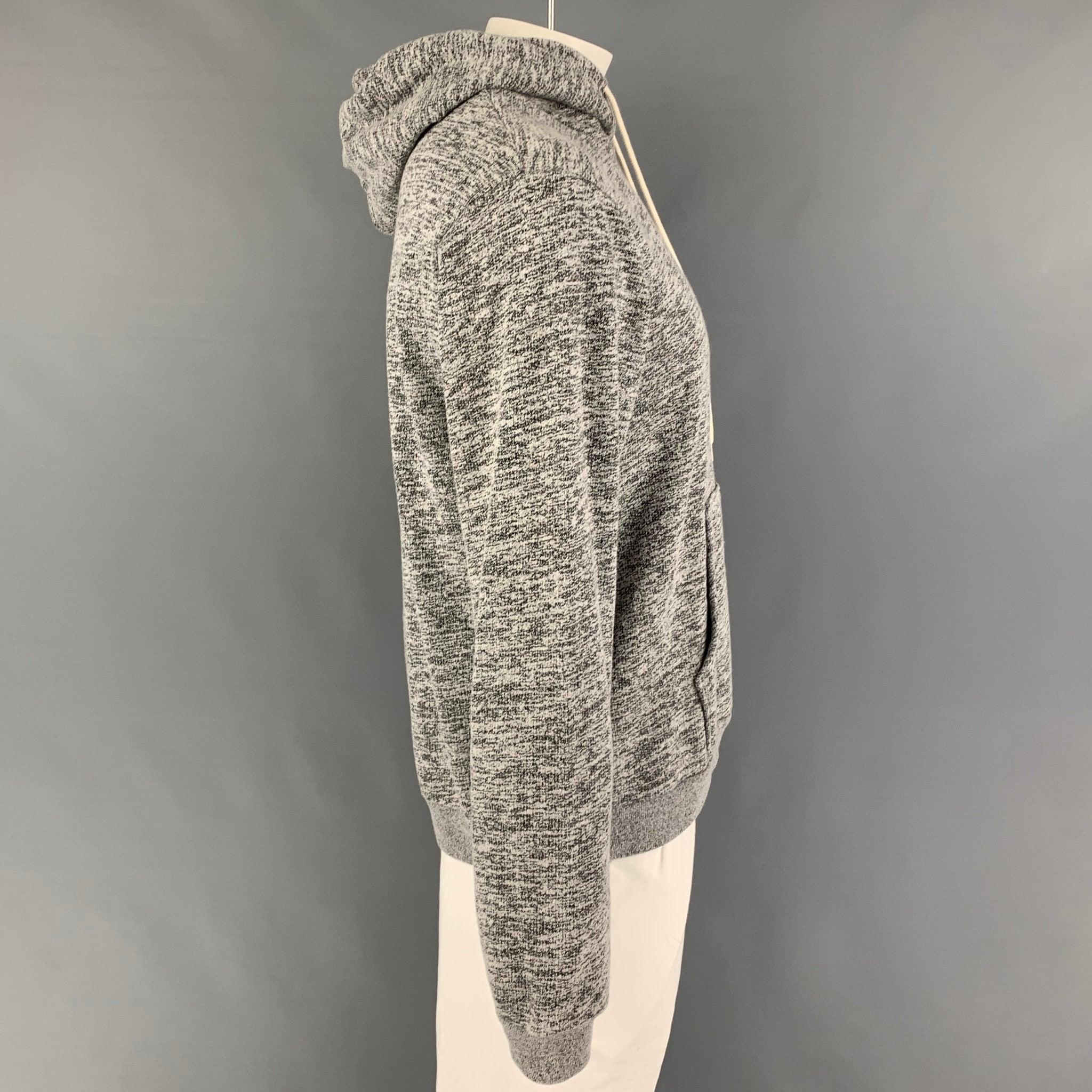 JOHN ELLIOTT sweatshirt comes in a grey heather cotton / polyester featuring a hooded style, pouch pocket, and a drawstring detail.
Very Good
Pre-Owned Condition. 

Marked:   4 

Measurements: 
 
Shoulder: 20.5 inches Chest: 44 inches Sleeve: 28