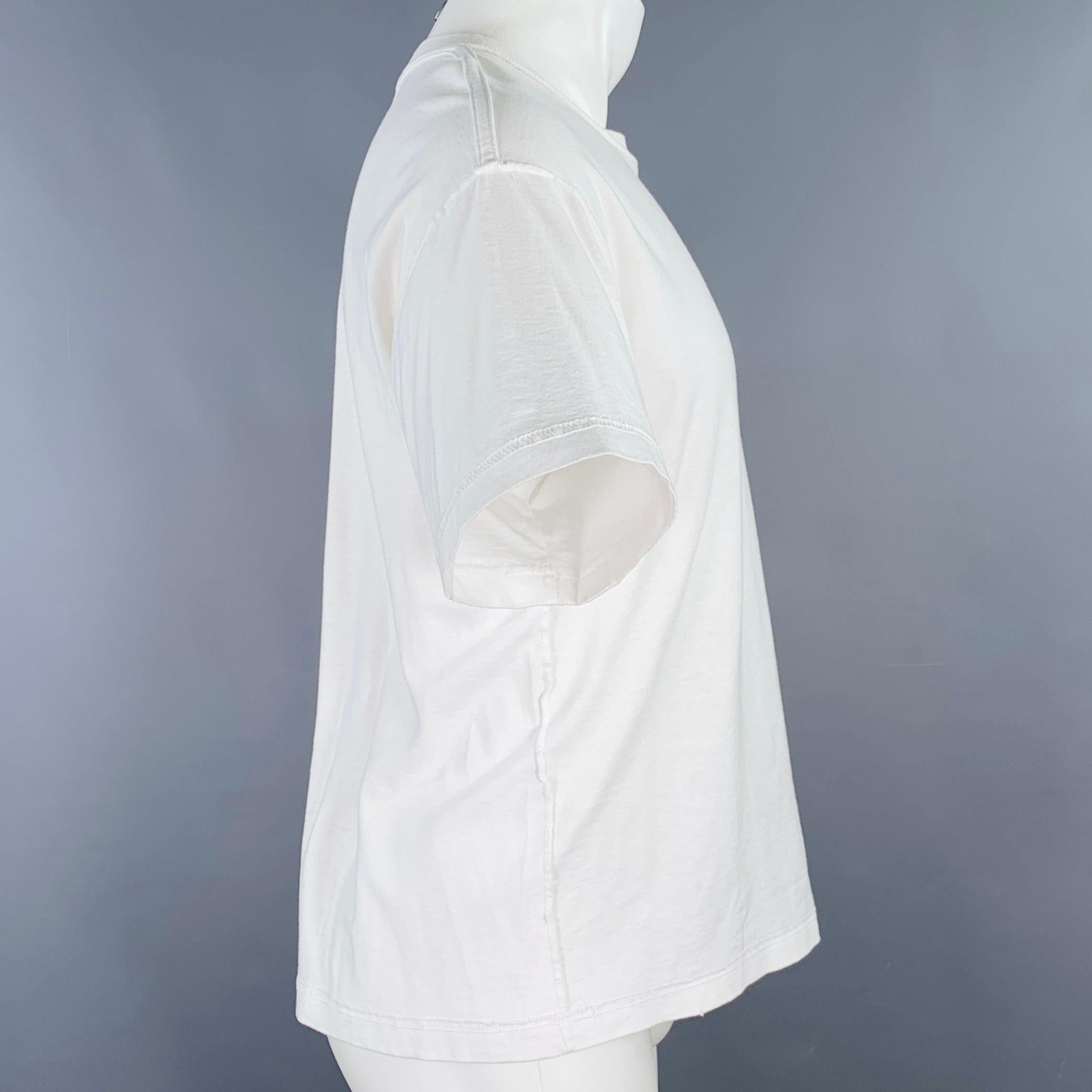 JOHN ELLIOTT t-shirt
in a white cotton jersey featuring a reverse seams design, relaxed fit, and crew neck. Made in USA.Very Good Pre-Owned Condition. Minor marks that are hard-to-see. 

Marked:   0 

Measurements: 
 
Shoulder: 20.5 inches Chest: 42